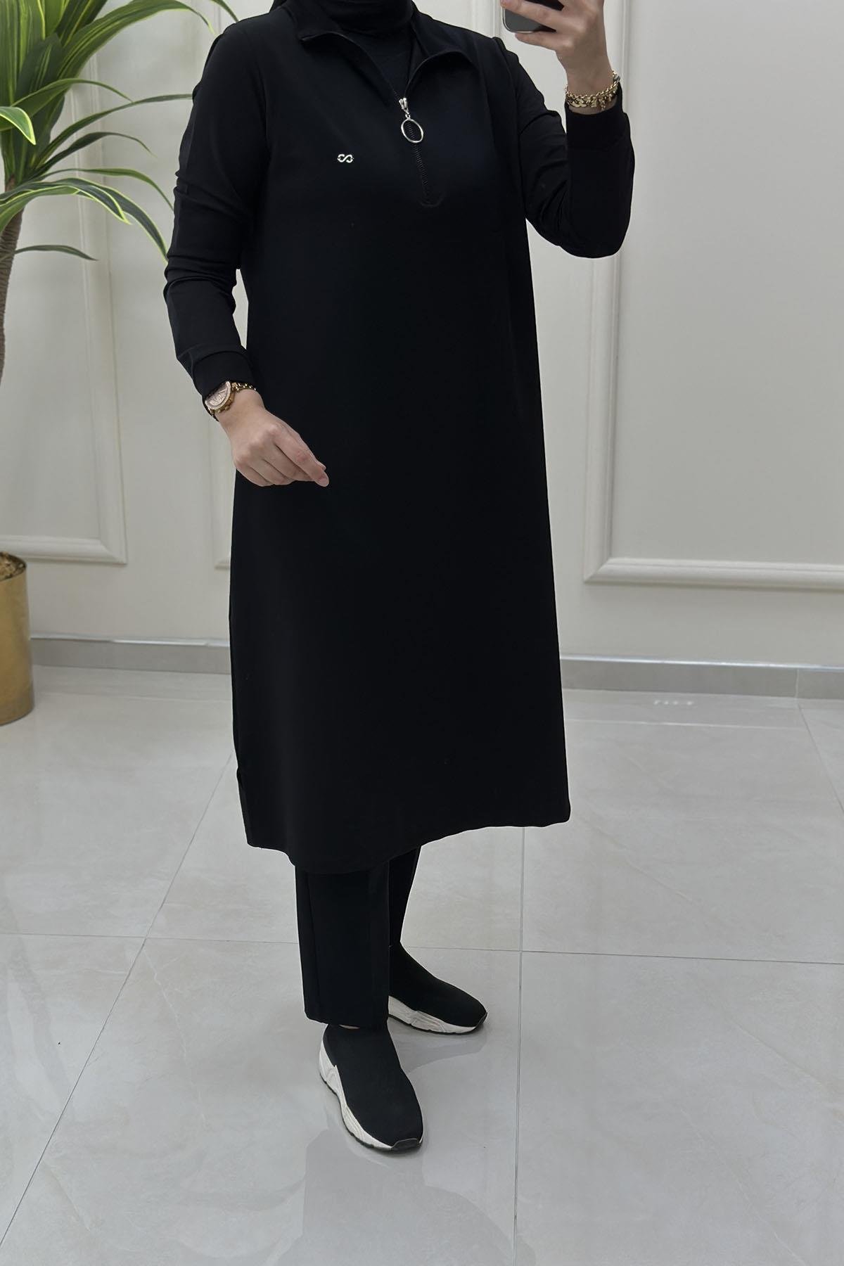 Tesettür Tunik ModelleriÖnü Yarım Fermuarlı Ribana Detaylı Kadın Tunik Siyah KADO 257322