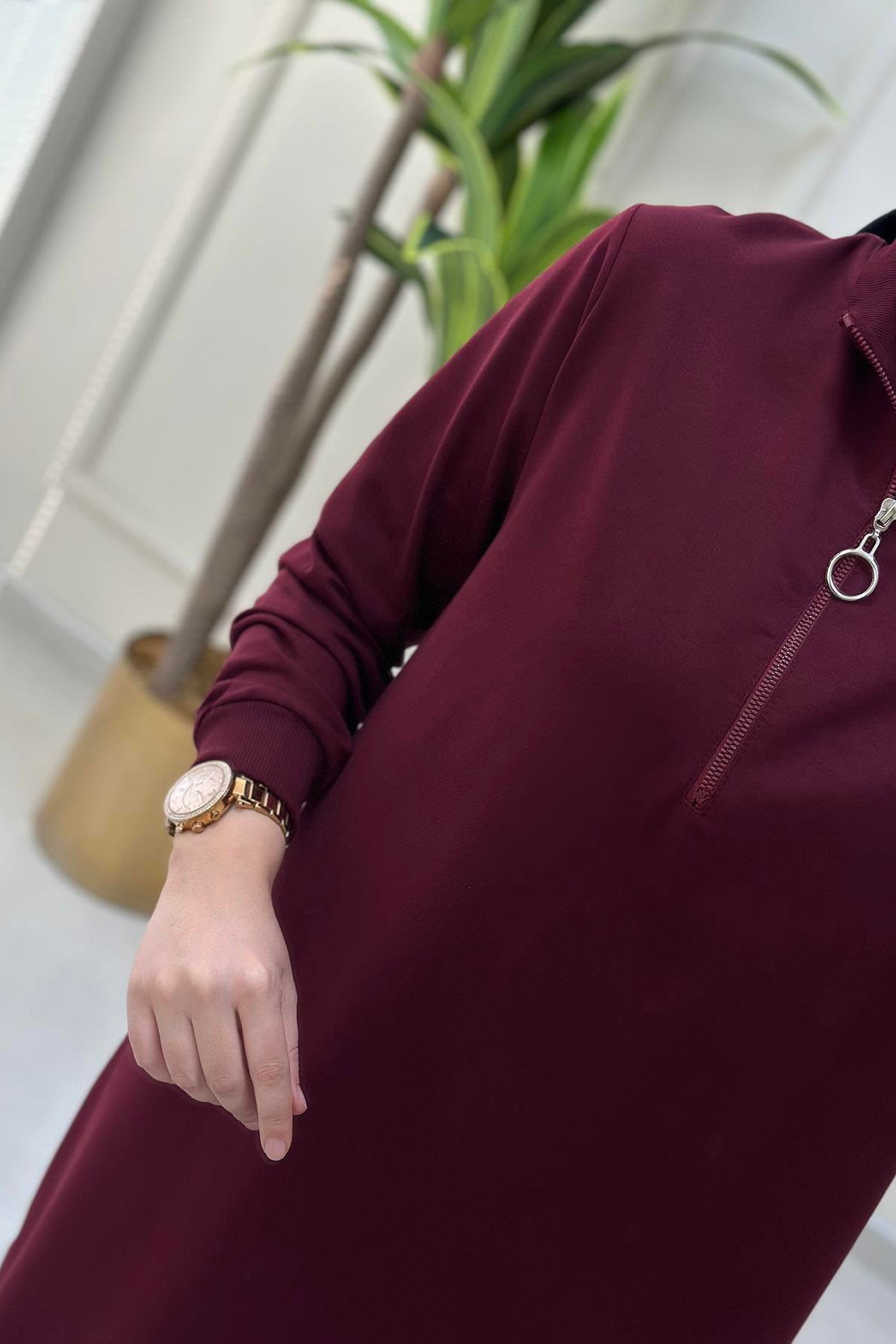 Tesettür TunikKol ve Yaka Ribanalı Önü Yarım Fermuarlı Kadın Tunik Bordo KADO 7568