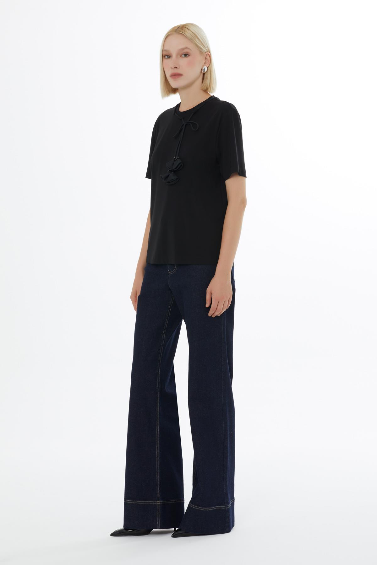 Black Blouse with Minimalist Accessory Details