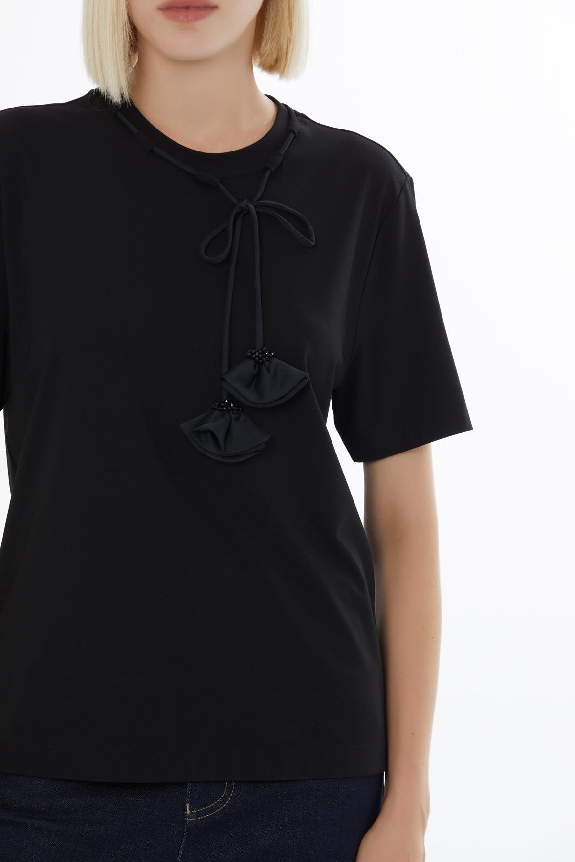 Black Blouse with Minimalist Accessory Details