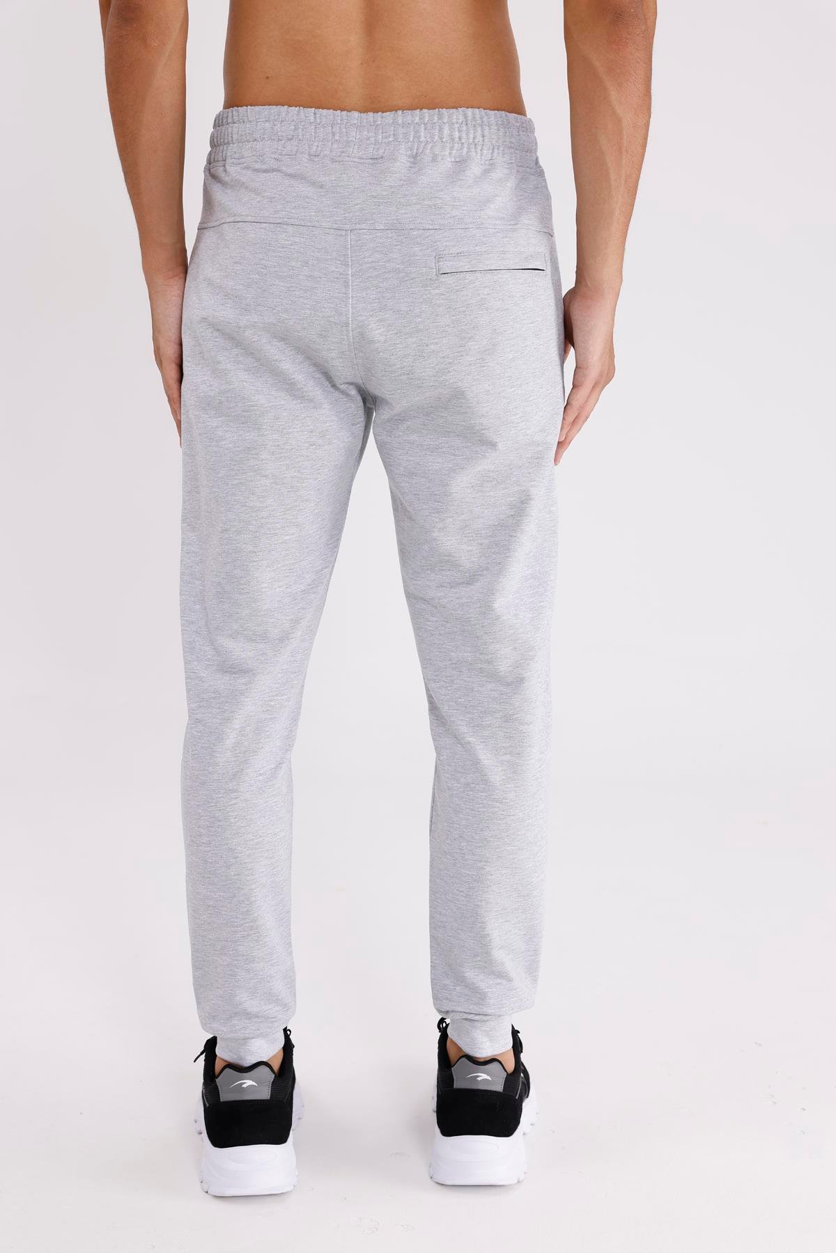Esnek Bel Bilek Lastikli Kontrast Biyeli Yan Cepli Tek Arka Cepli Daralan Paça Mevsimlik Örme Kumaş Eşofman Altı