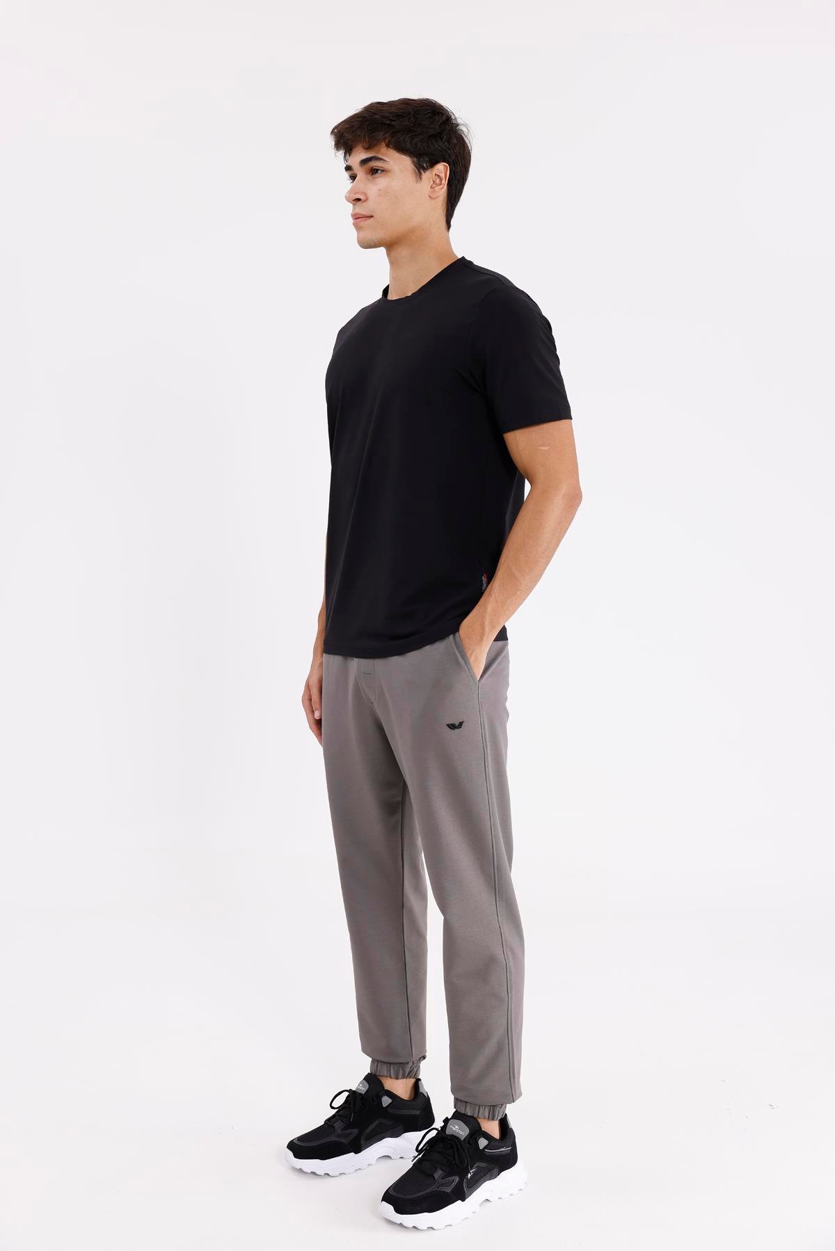 Yumuşak Dokulu Esnek Bel Lastikli Yan Cepli Rahat Kesim Paça Lastikli Mevsimlik Örme Eşofman Altı