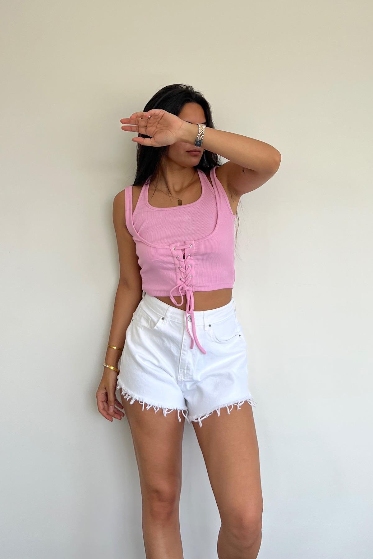 CROP-BLUSE MIT VOGELAUGEN-LINKSVERKLEIDUNG