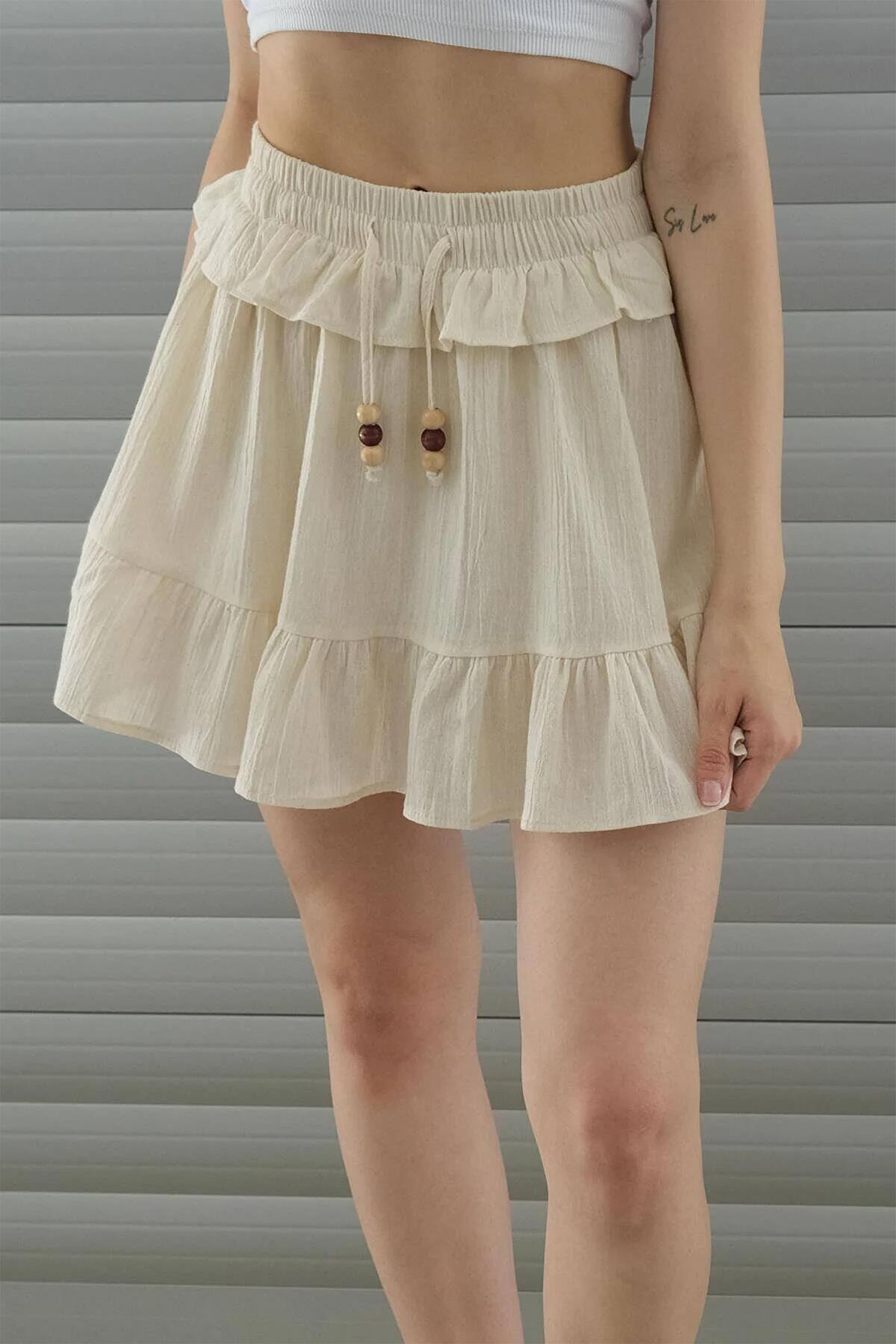 تنورة من الكتان بتفاصيل حزام وحزام