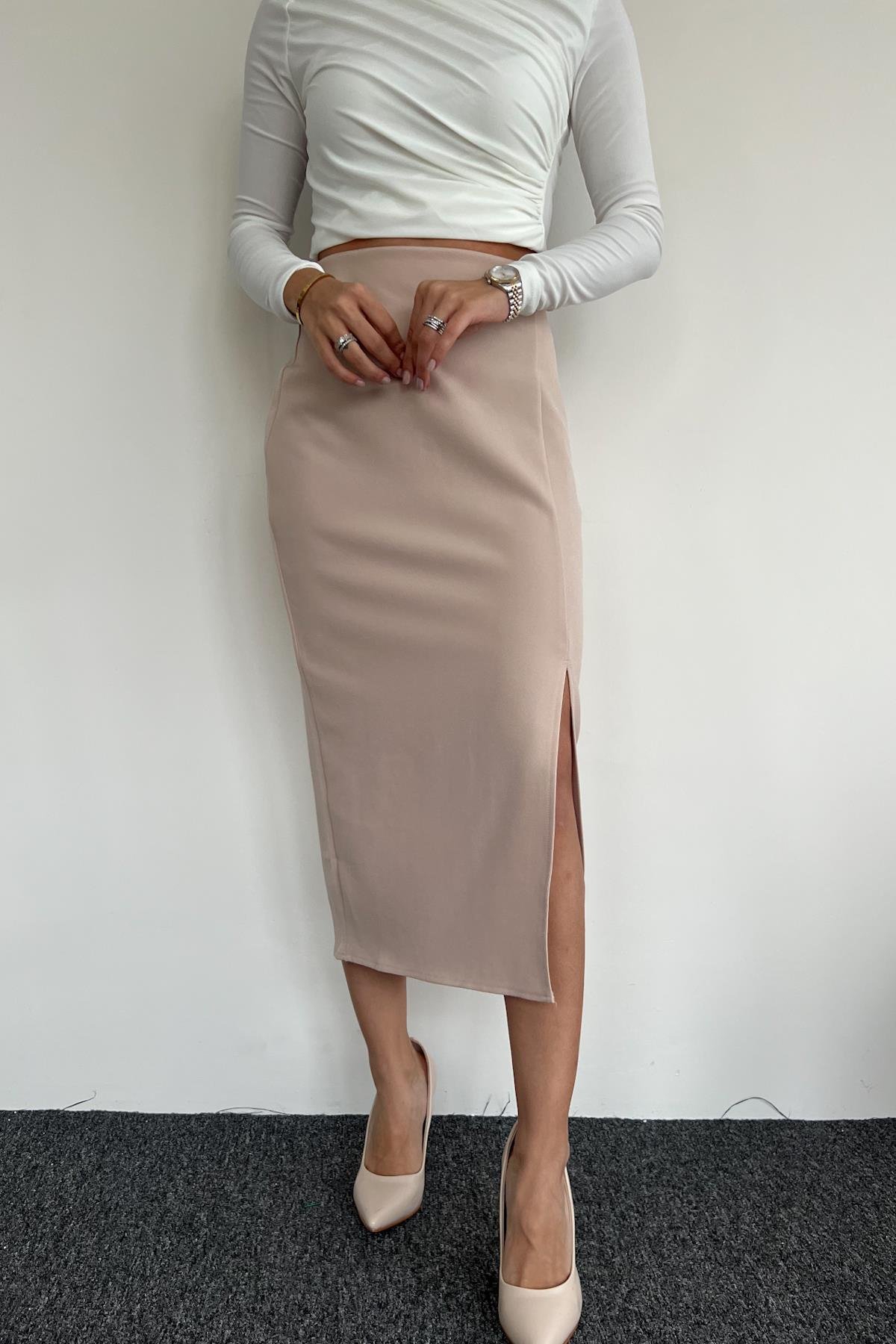 KUMAŞ ETEĞİ YIRTMAÇLI ETEK TAŞ