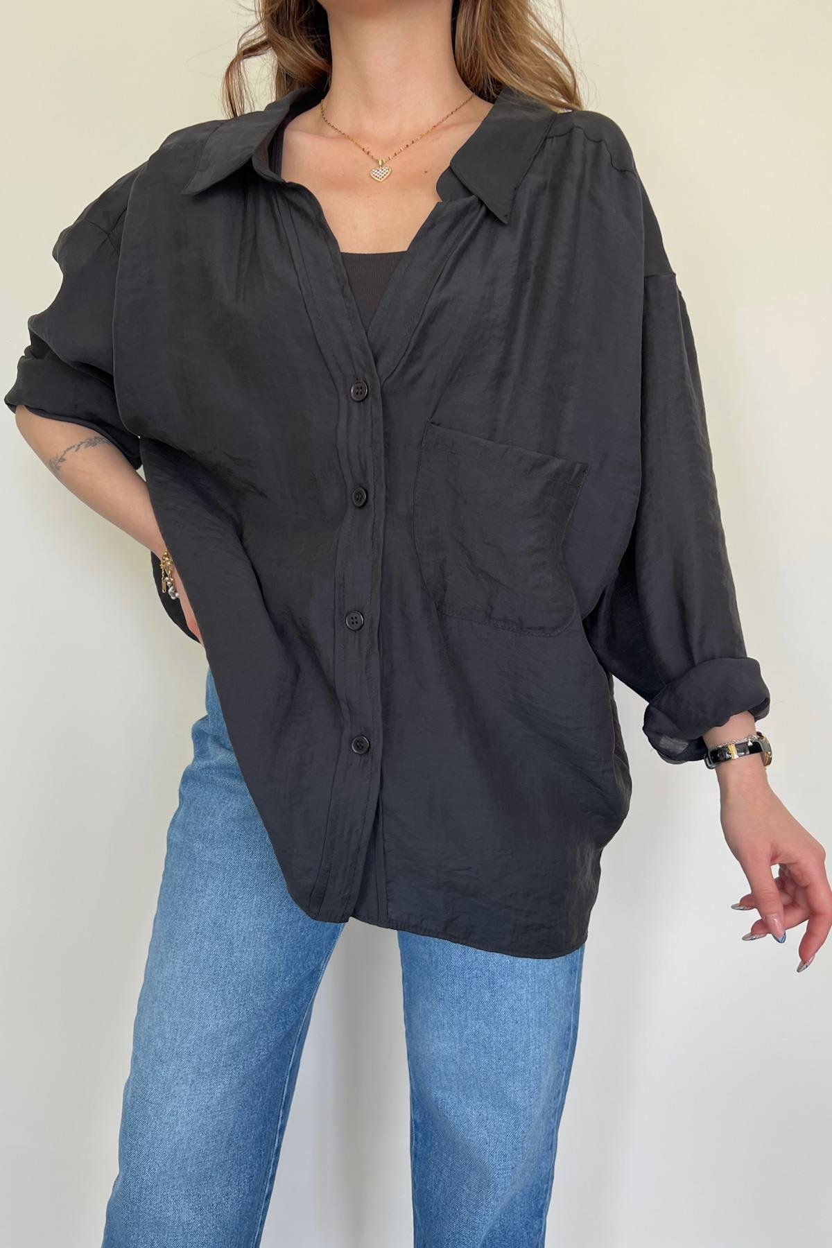 قميص كبير الحجم بأكتاف منخفضة