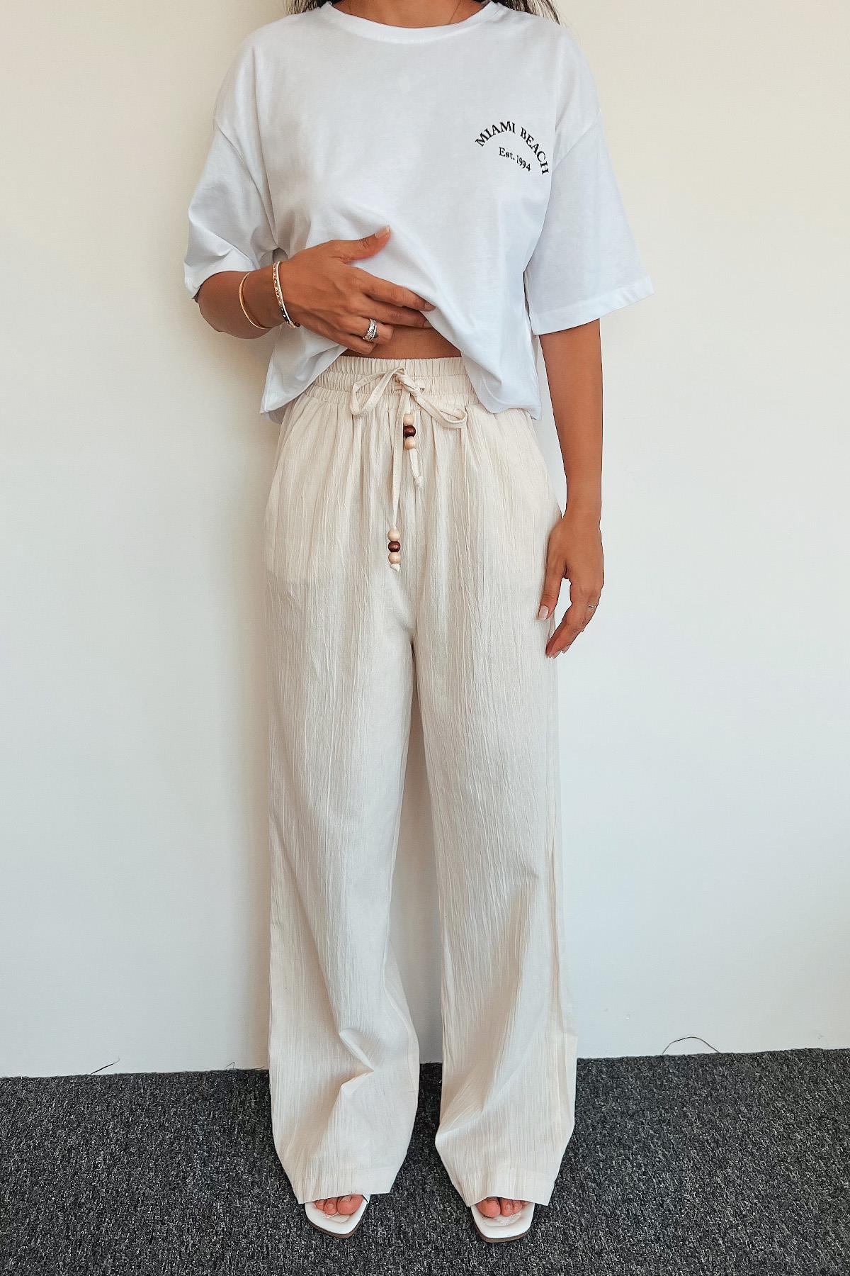 خصر مرن وسروال قطني طويل الأرجل بتفاصيل الخرز