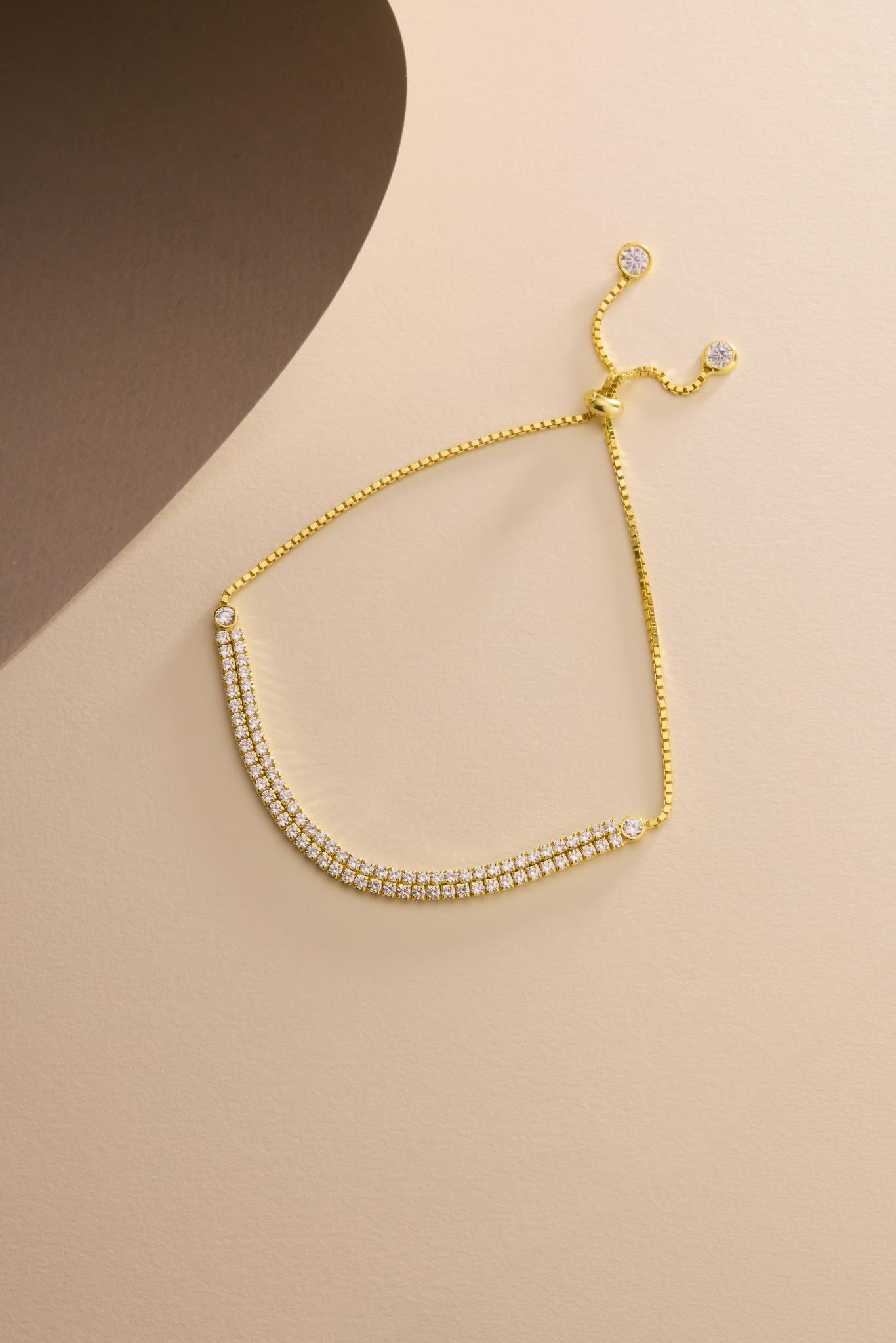 925 Ayar Gümüş Gold Kaplama Ayarlanabilir Asansörlü 2 mm Zirkon Taşlı Çift Sıra Su Yolu Bileklik