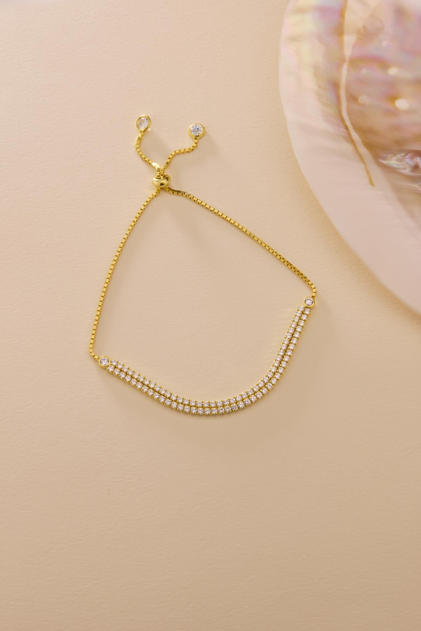 925 Ayar Gümüş Gold Kaplama Ayarlanabilir Asansörlü 2 mm Zirkon Taşlı Çift Sıra Su Yolu Bileklik