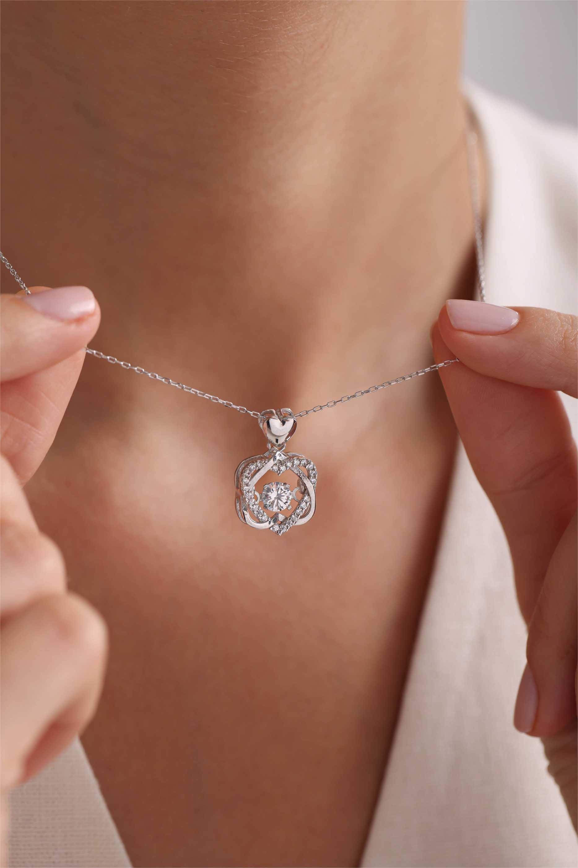925 Ayar Gümüş Rodyum Kaplama Hareketli Minik Taşlı Çift Kalpli Model Kolye