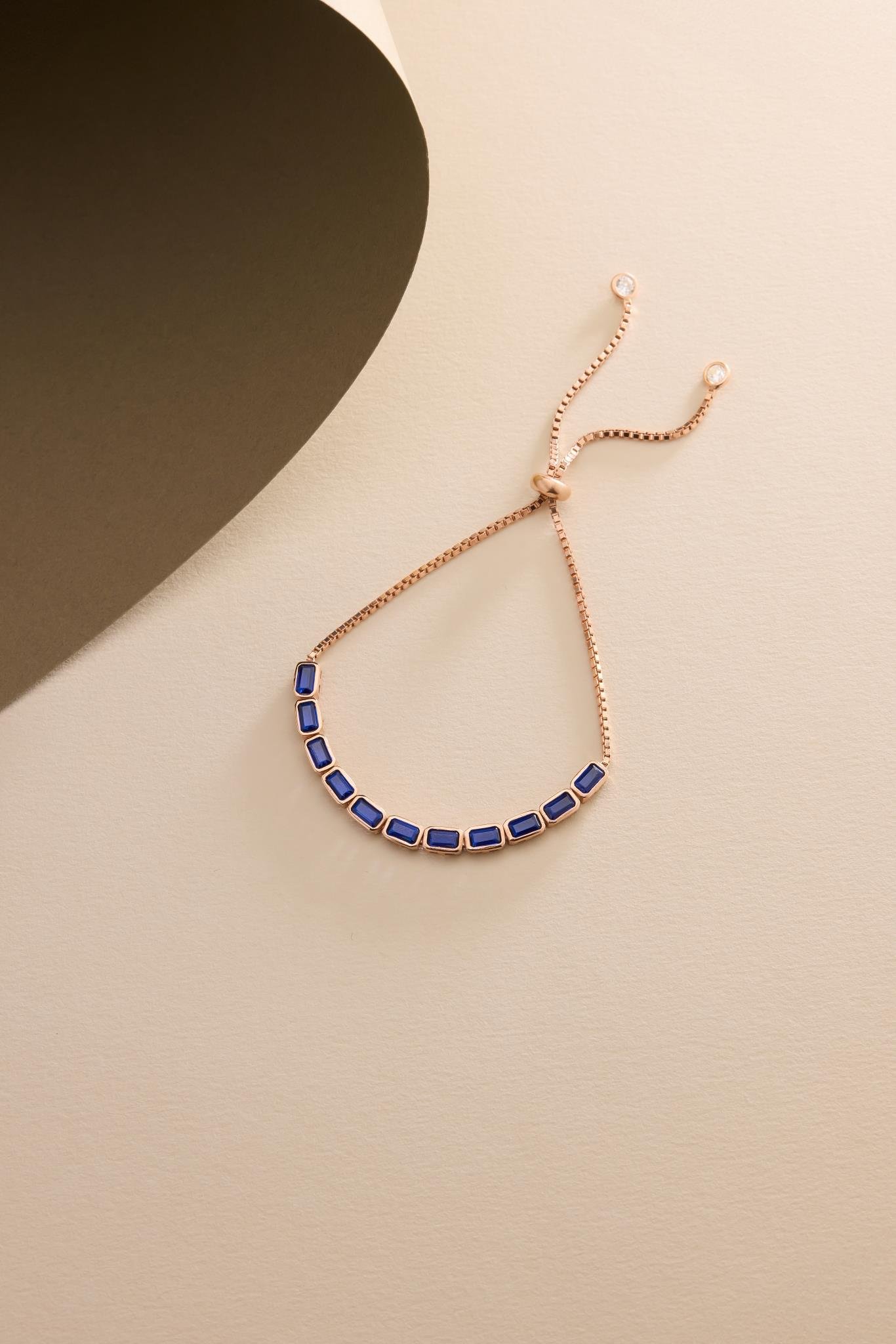 925 Ayar Gümüş Rose Kaplama Ayarlanabilir Asansörlü Sıralı Mavi Baget Taşlı Bileklik