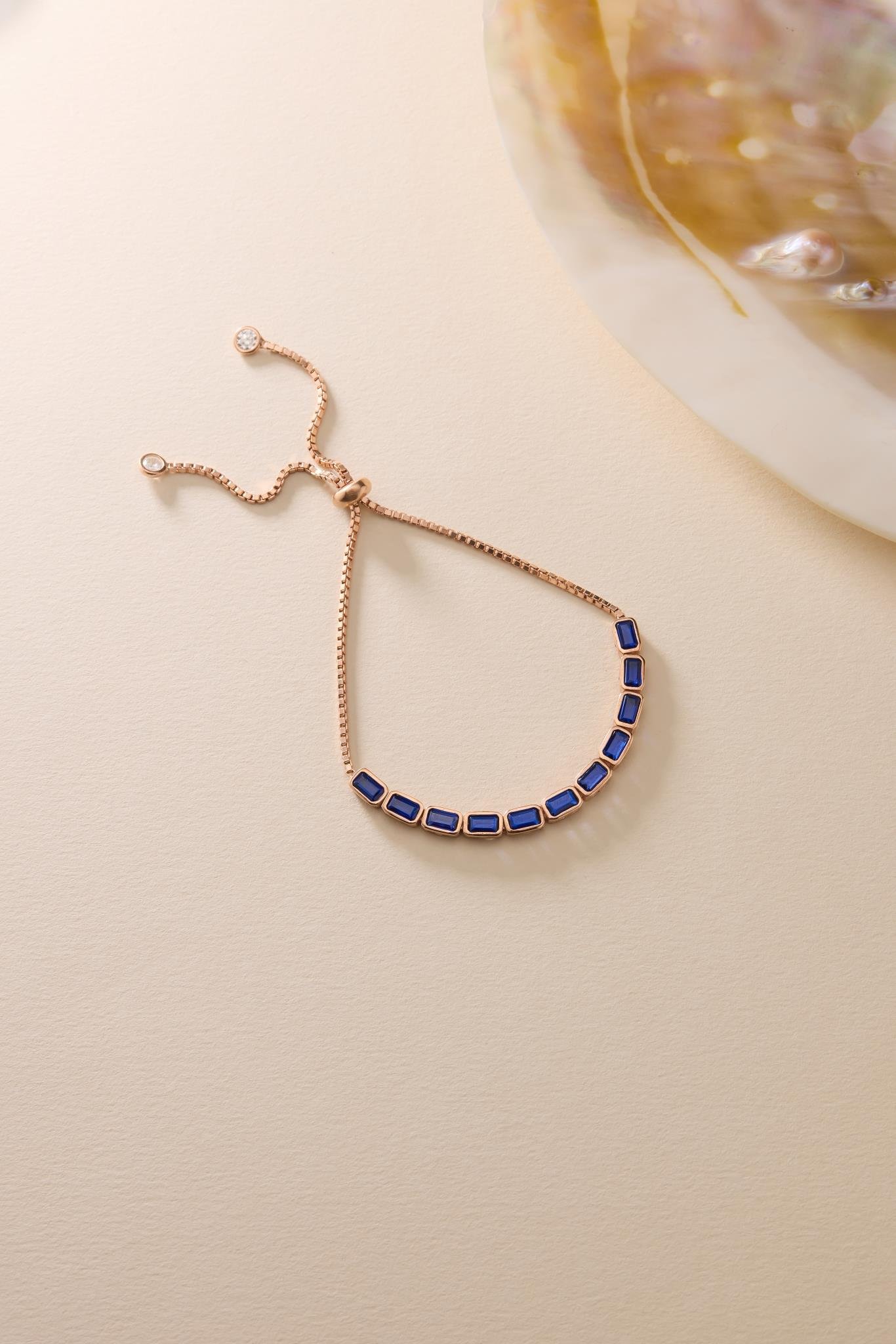 925 Ayar Gümüş Rose Kaplama Ayarlanabilir Asansörlü Sıralı Mavi Baget Taşlı Bileklik