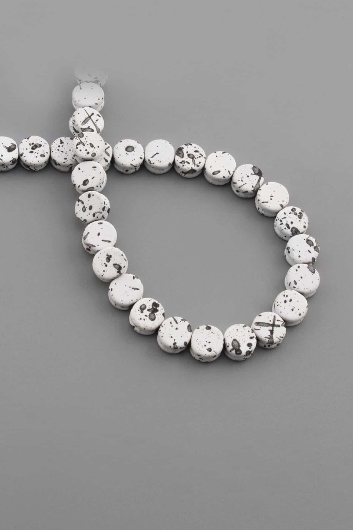Hematite Natural Stone Mottled White Circle Cut 8x4mm String Of Beads