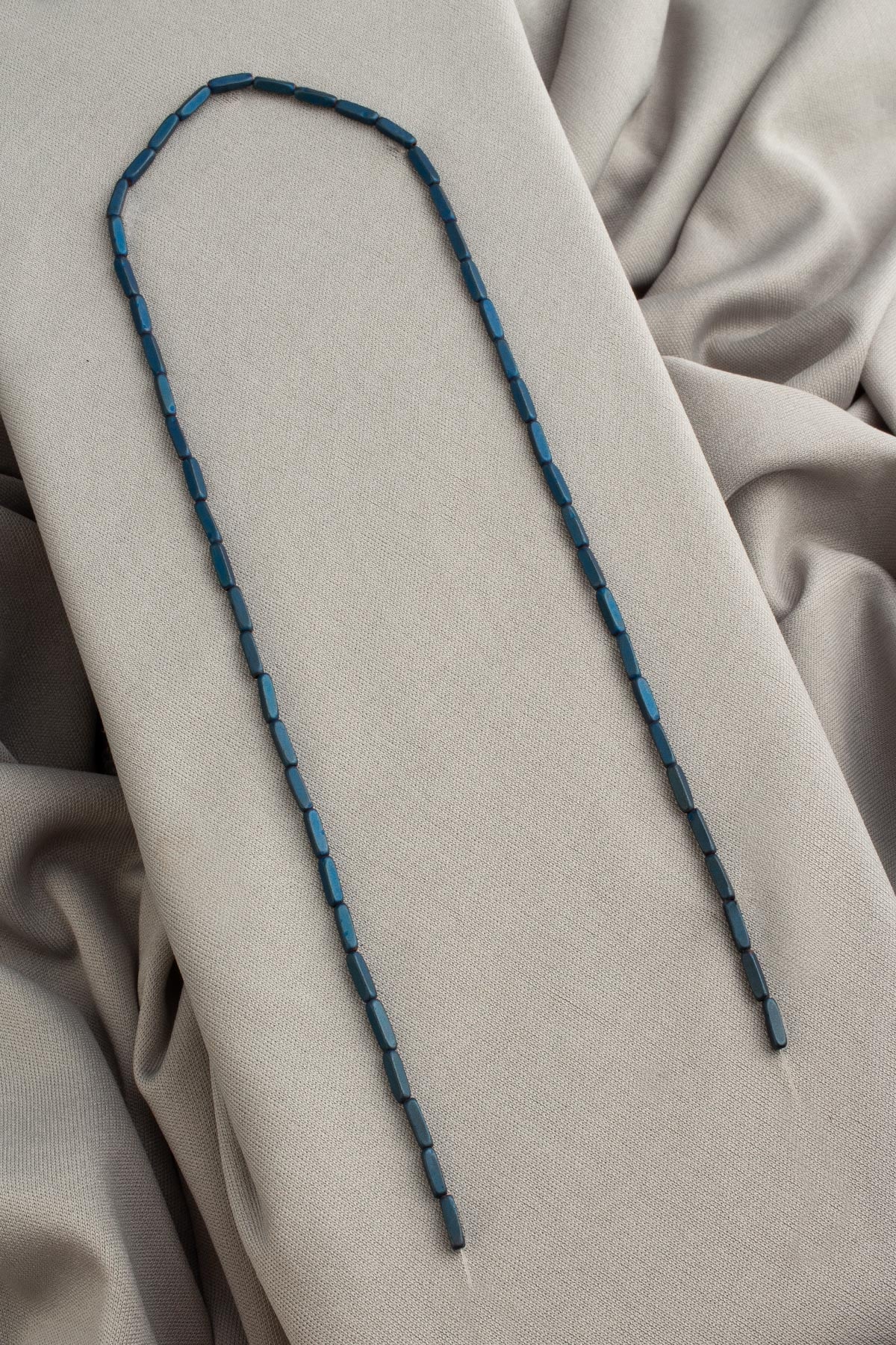 Hematite Natural Stone Matte Blue Dished Rectangular 2x8mm String Of Beads