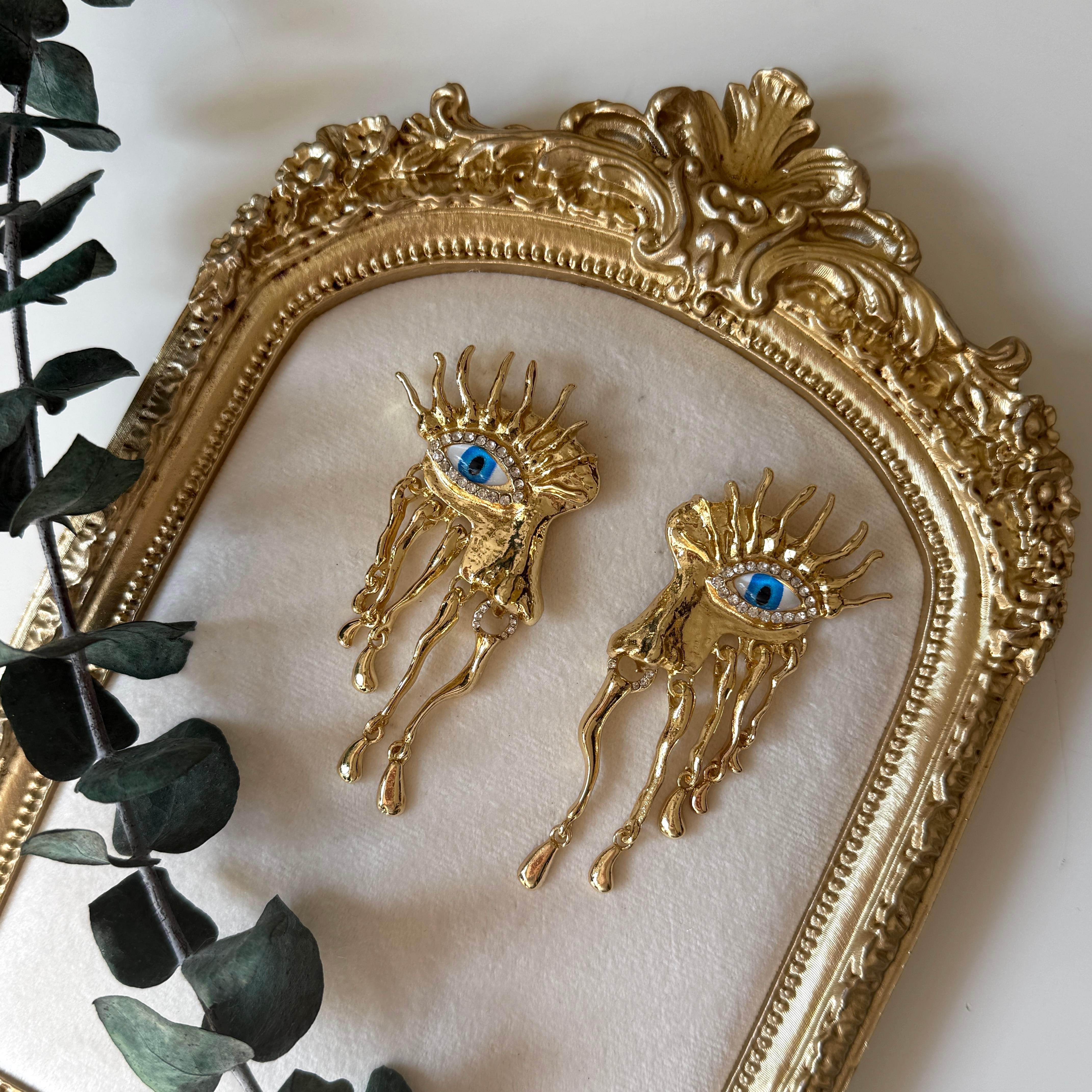 Marka Mavi Gözlü Sallantılı Yüz Küpe