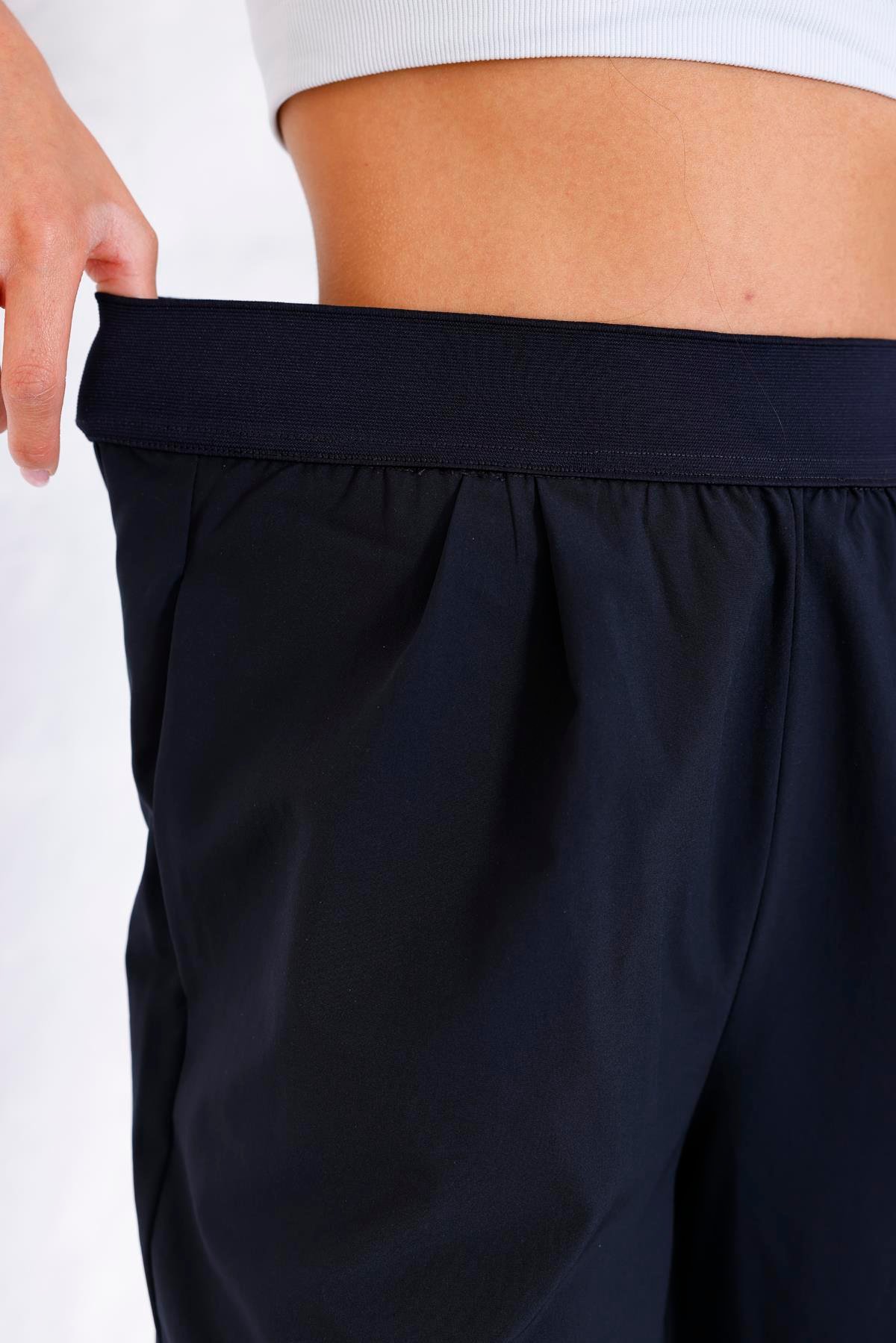 Kadın Lacivert Paraşüt Beli Lastikli Yüksel Bel Cepli Bol Paça Pantolon - 3057