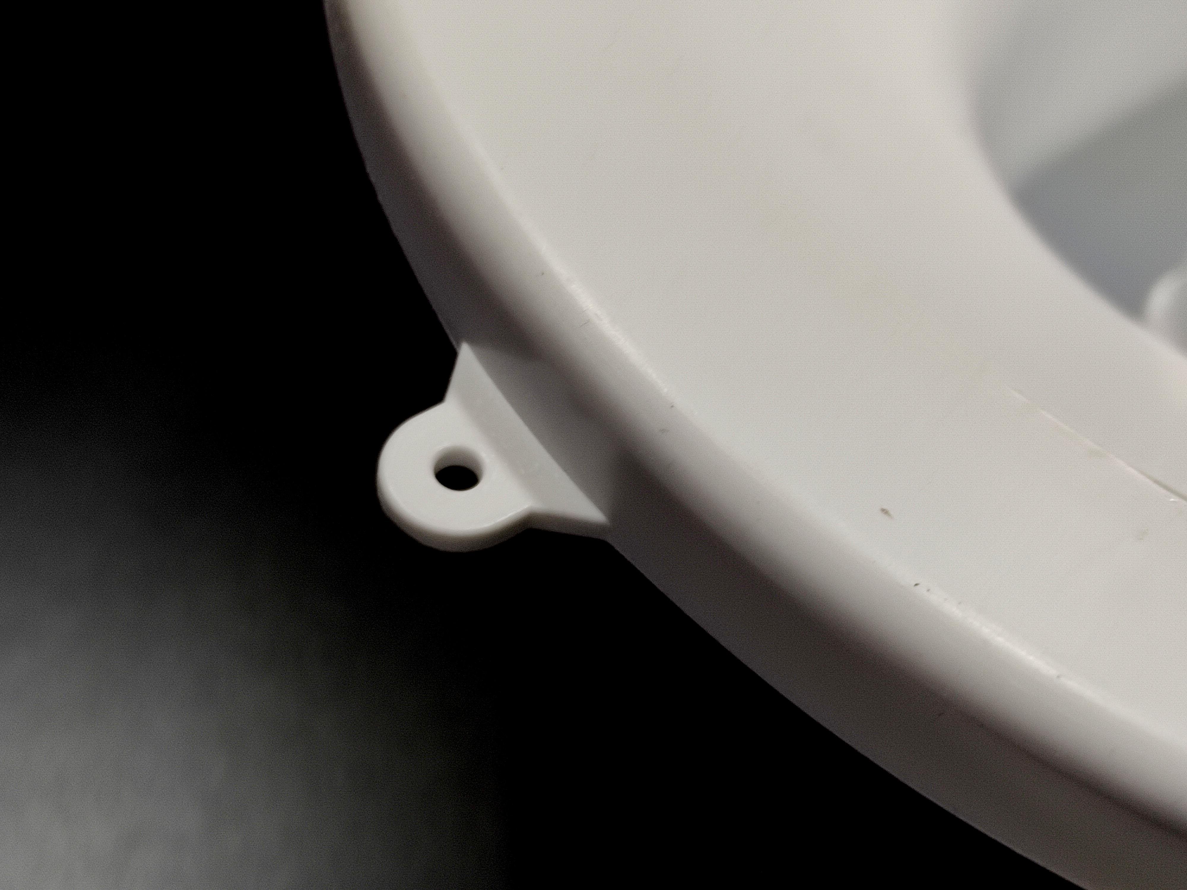 Water dispenser universal bottle holder punch, white color.