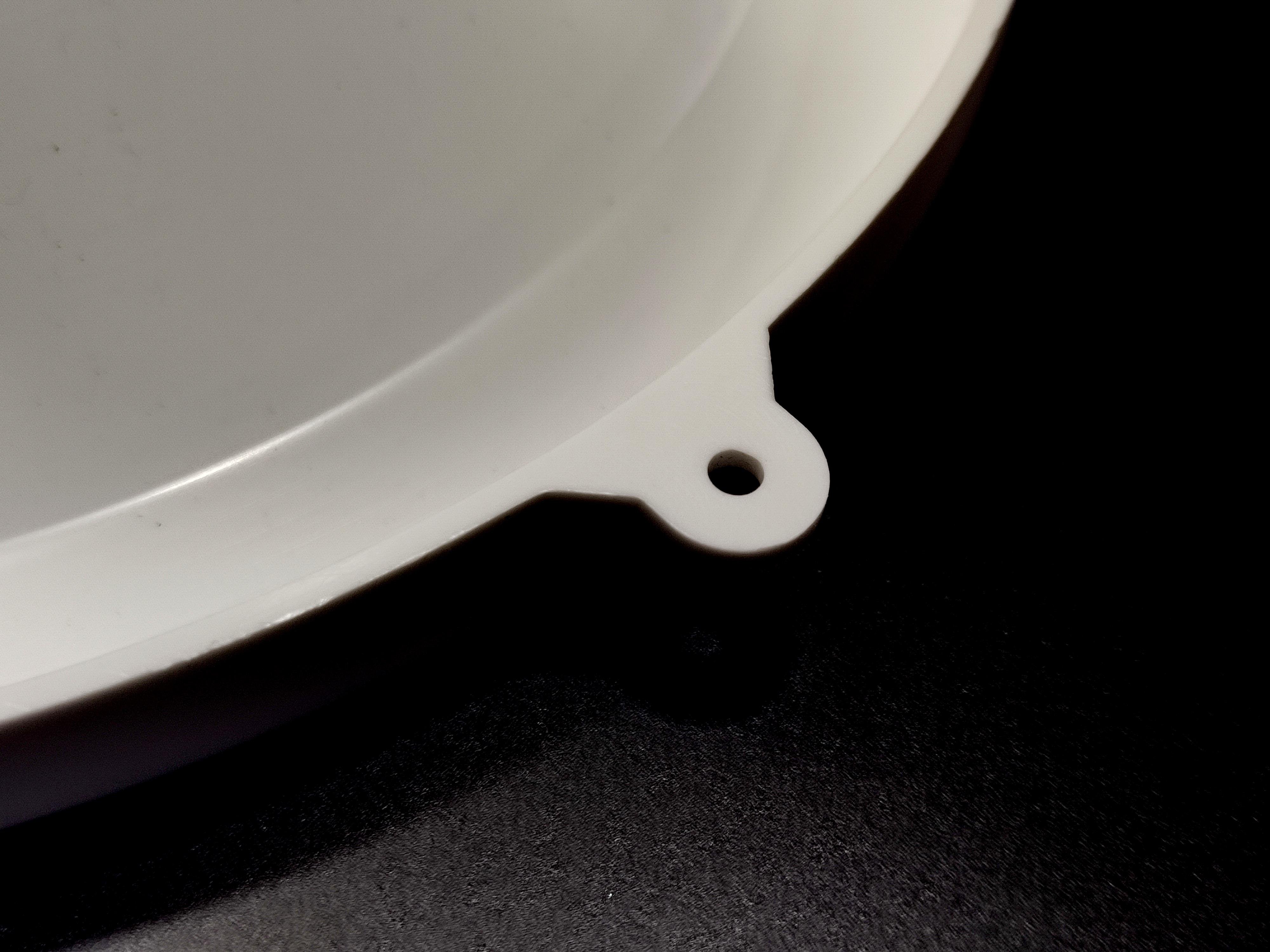 Water dispenser universal bottle holder punch, white color.