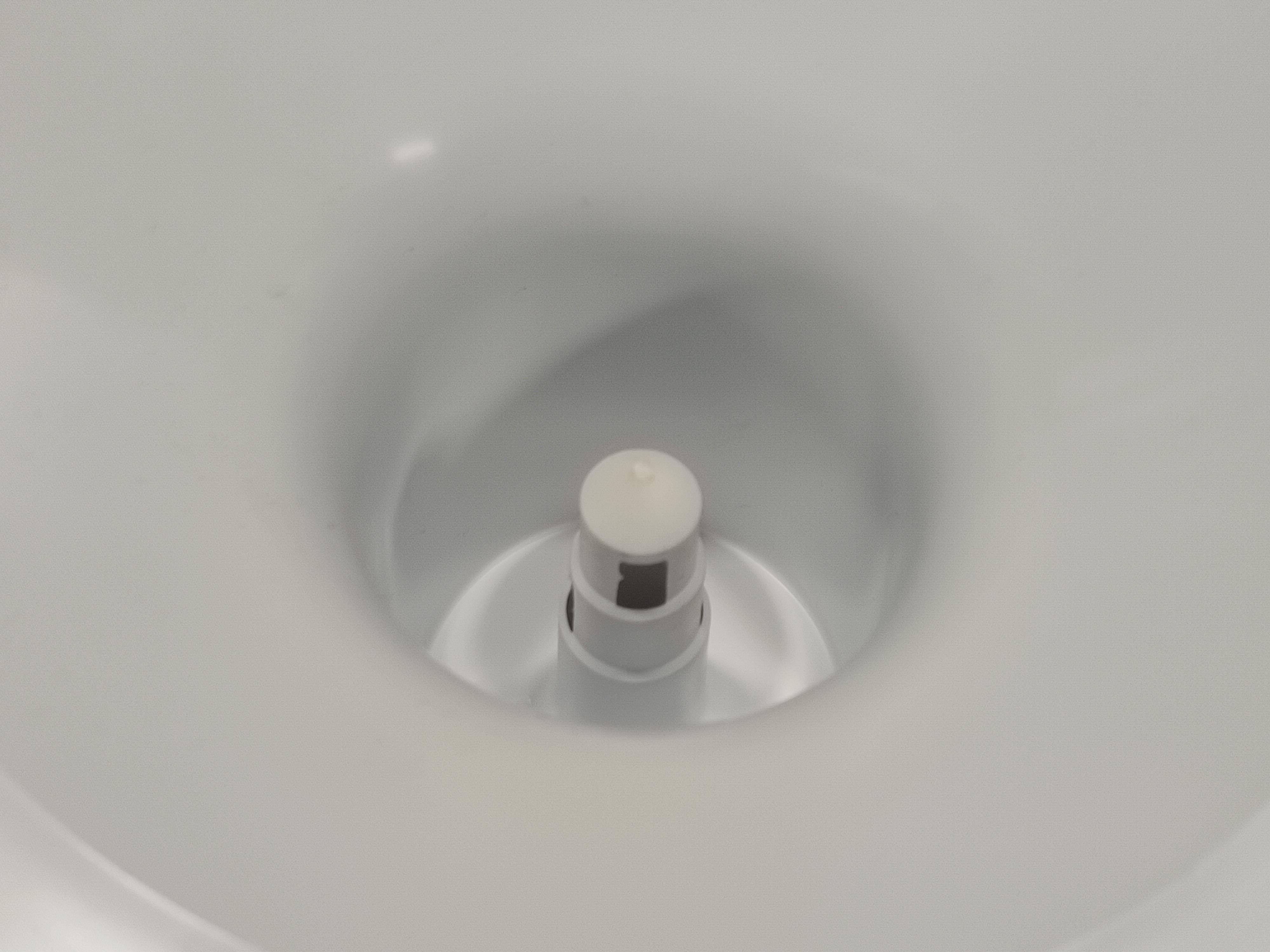 Water dispenser universal bottle holder punch, white color.
