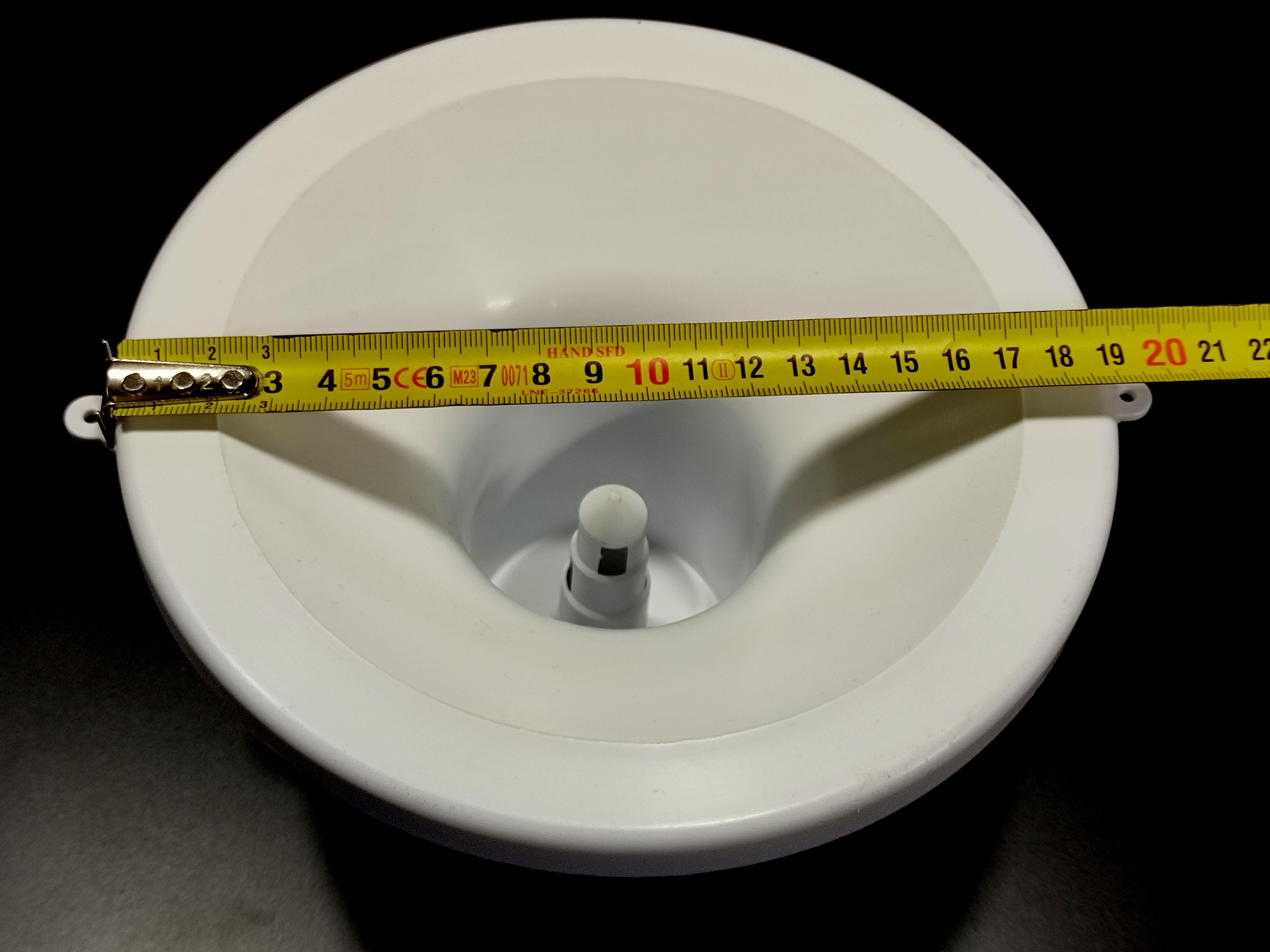 Water dispenser universal bottle holder punch, white color.