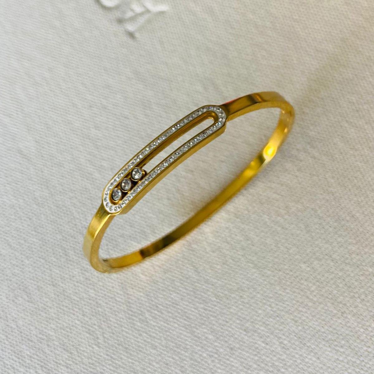 Hareketli Taşlı Gold Çelik Kelepçe