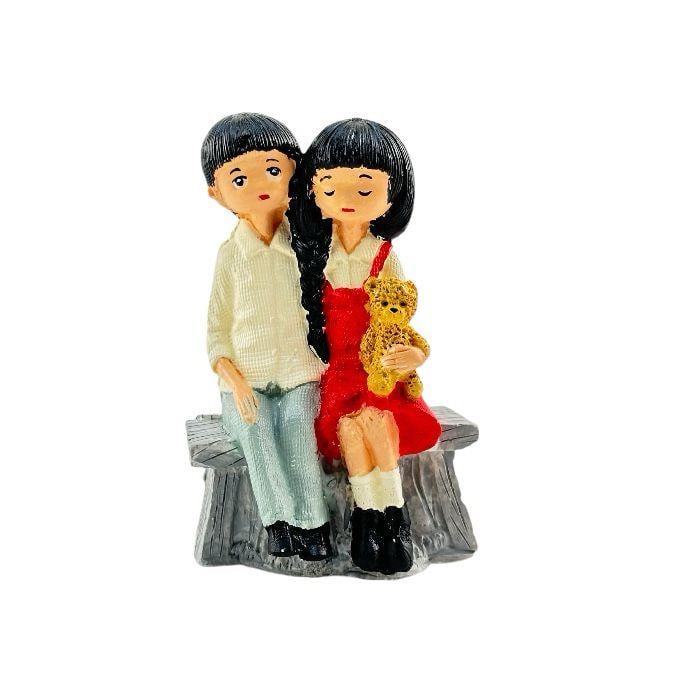 Kütükte Oturan Çift 