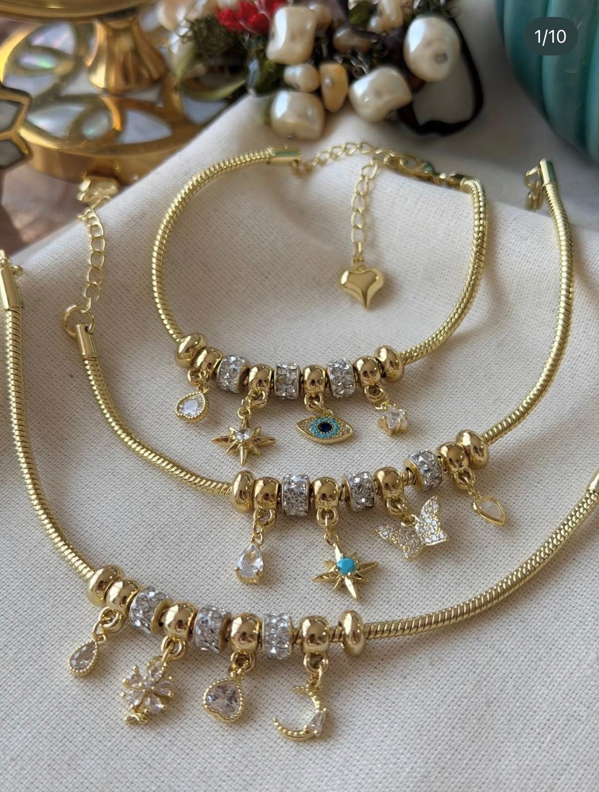 VİP SERİ NAZAR GÖZ MODEL KUTUP YILDIZI DETAYLI GOLD CHARM BİLEKLİK