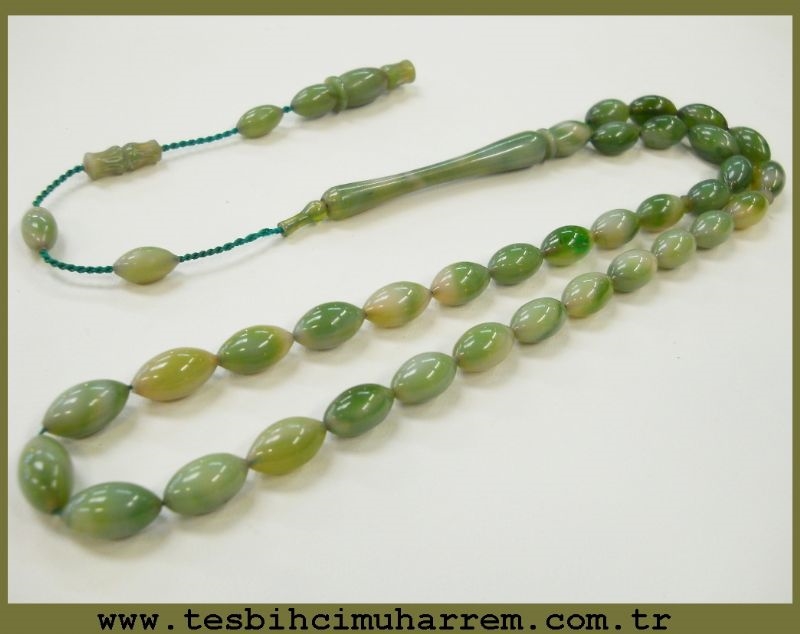 6.5X11.5 mm TESBİH-ÜL BAHARİSTAN DAMARLI YEŞİLLER TONDA SIKMA KEHRİBAR