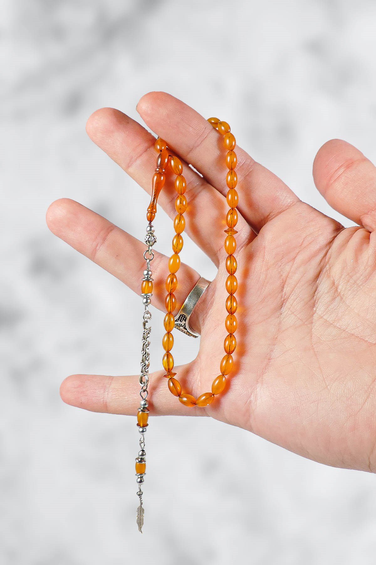 Bilek Boy İnce Taneli Tek Dal Püsküllü Sıkma Kehribar Tesbih