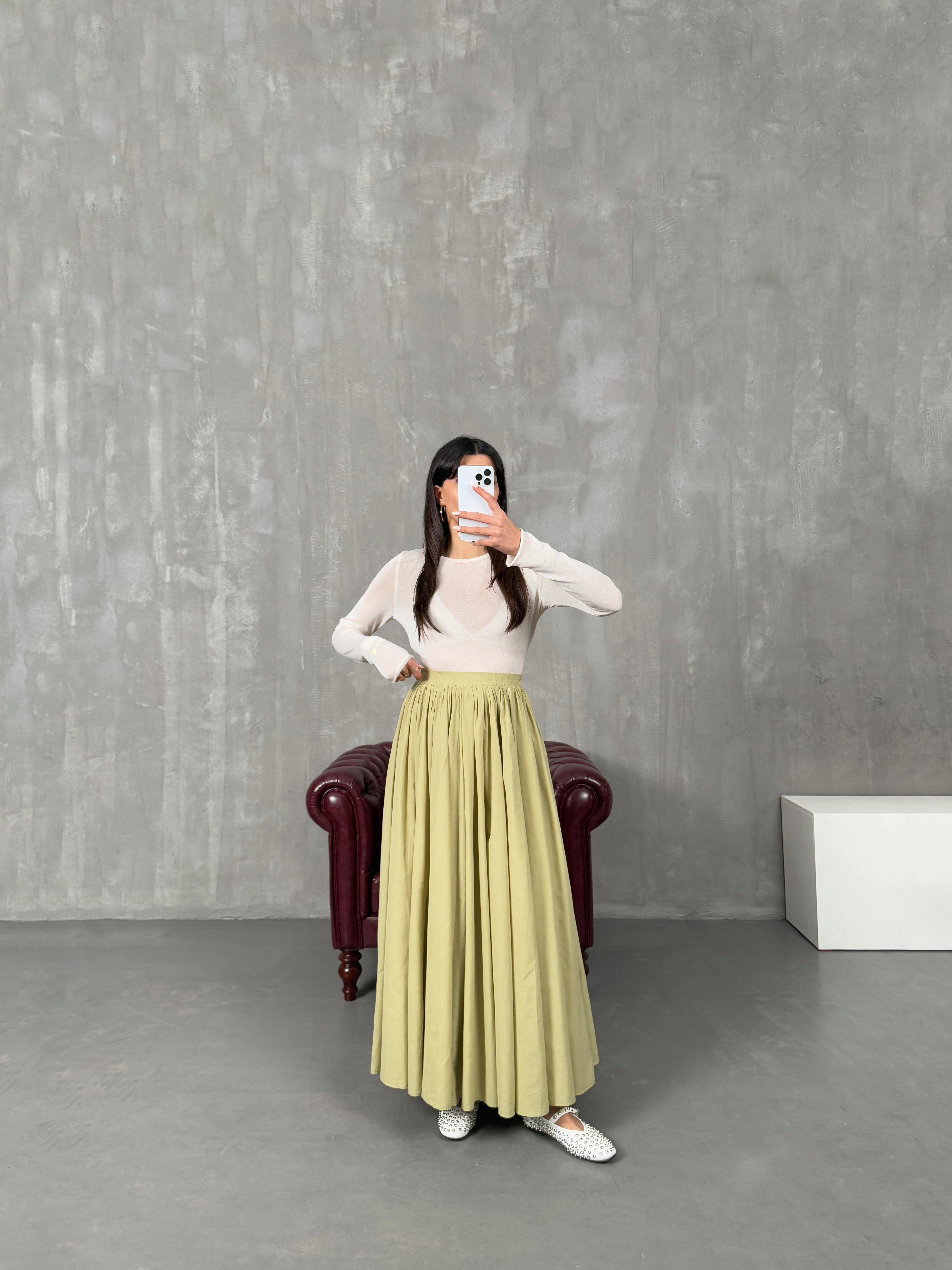 جولينا تنورة قماش فوال أخضر مبطّنة