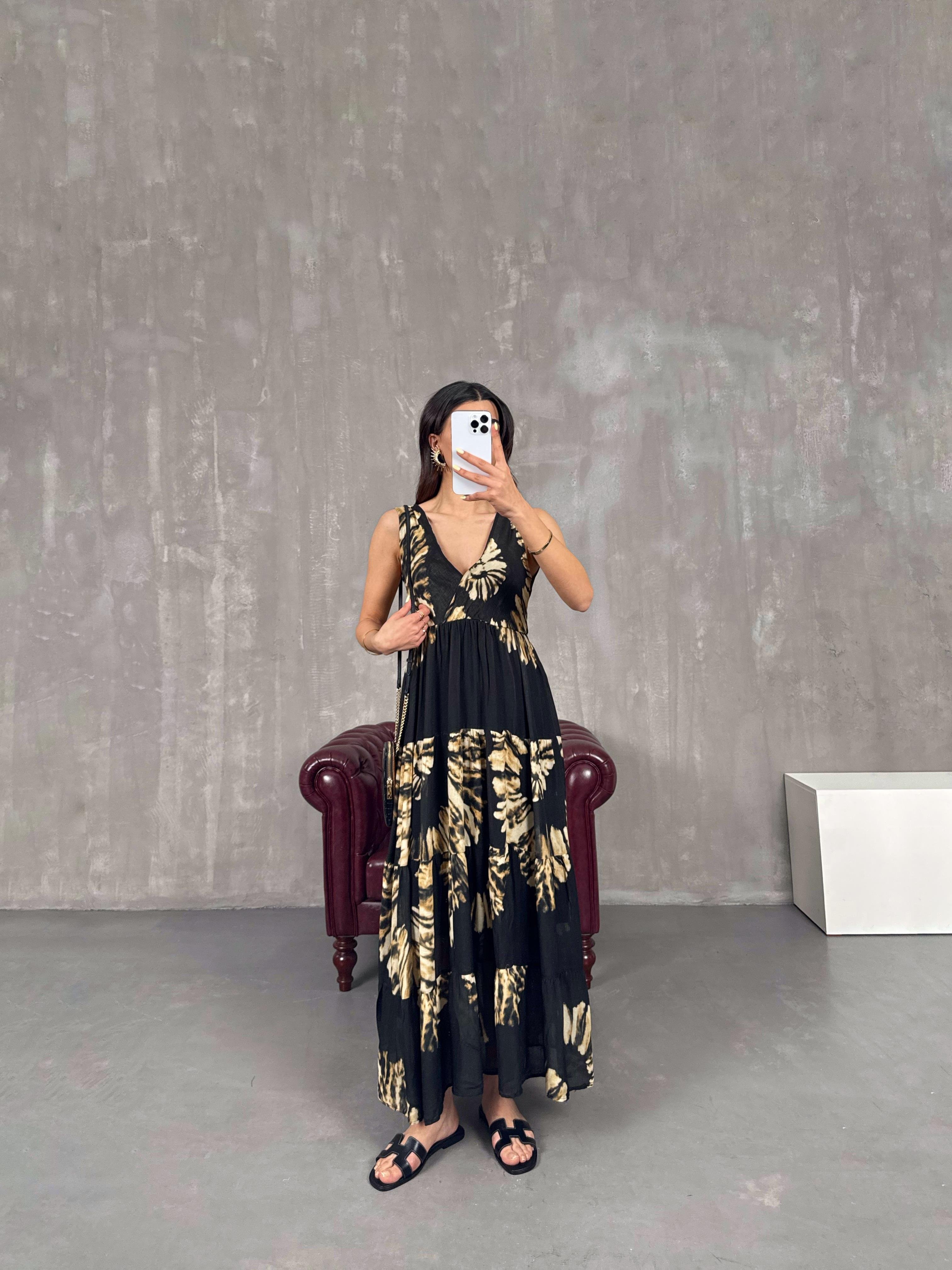 فستان أسود بخصر مطاطي ومزخرف بنقشة فهد Gaus00113