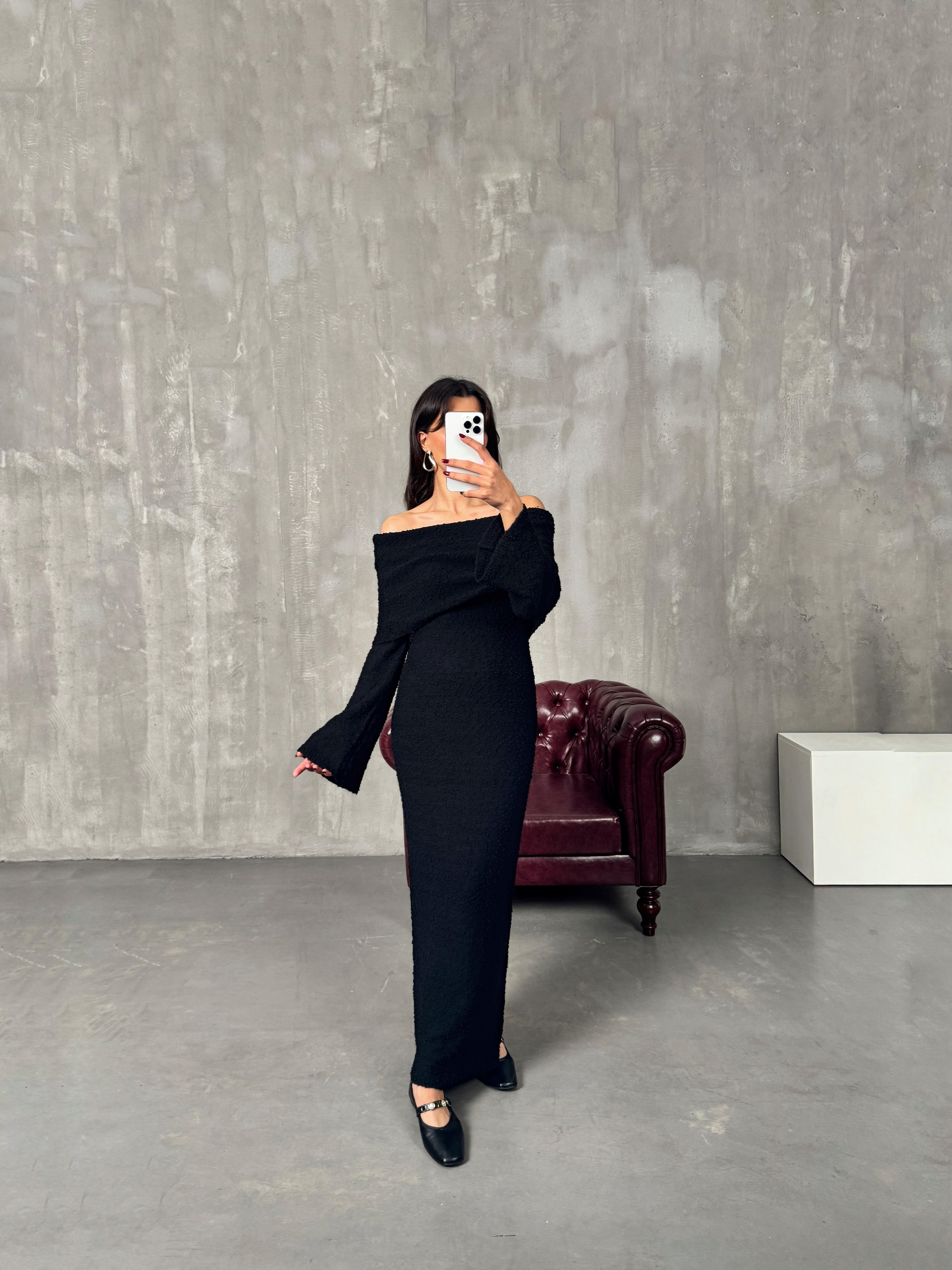 نانسي فستان تريكو أسود بياقة قارب وتصميم عصري