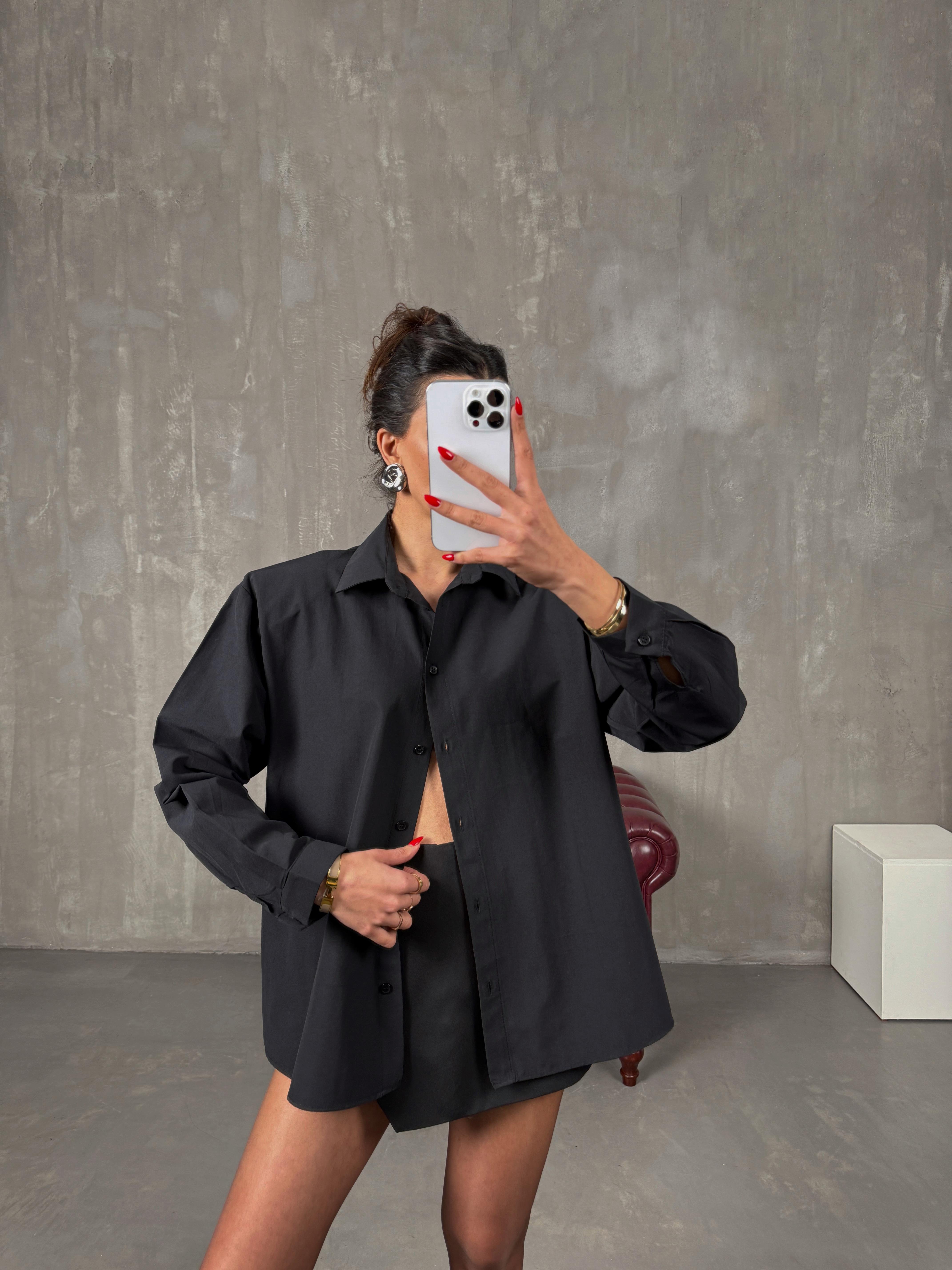 زولير قميص أسود بأكتاف مبطّنة