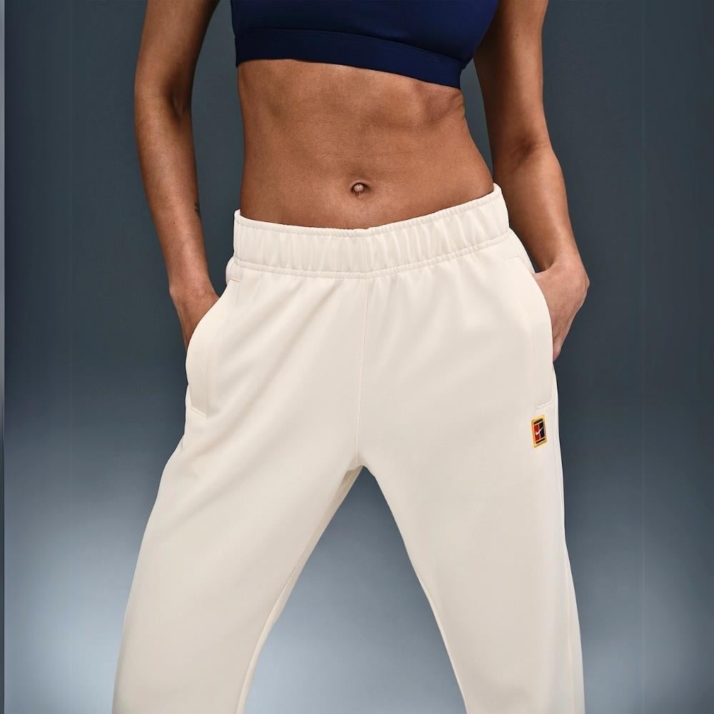 NikeCourt Heritage Windrunner Normal Belli Tenis Eşofman Altı - Krem