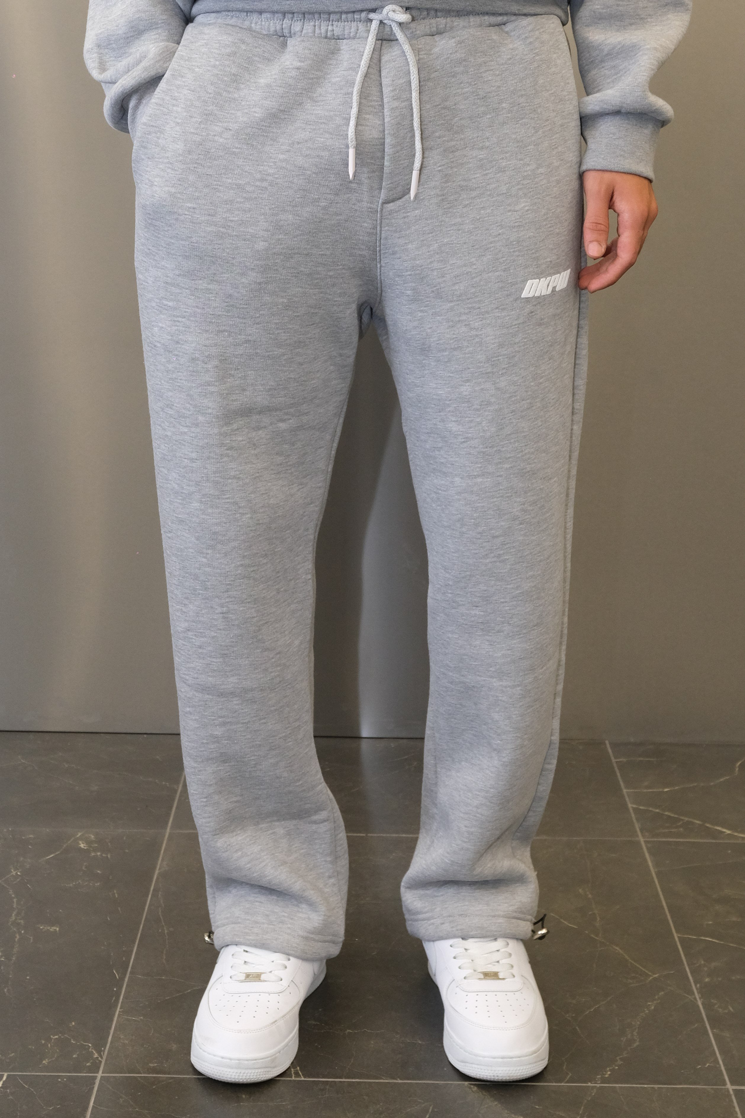 DKPW KABARTMA BASKILI BAGGY KALIP ŞARDONLU EŞOFMAN ALTI GRİMELANJ