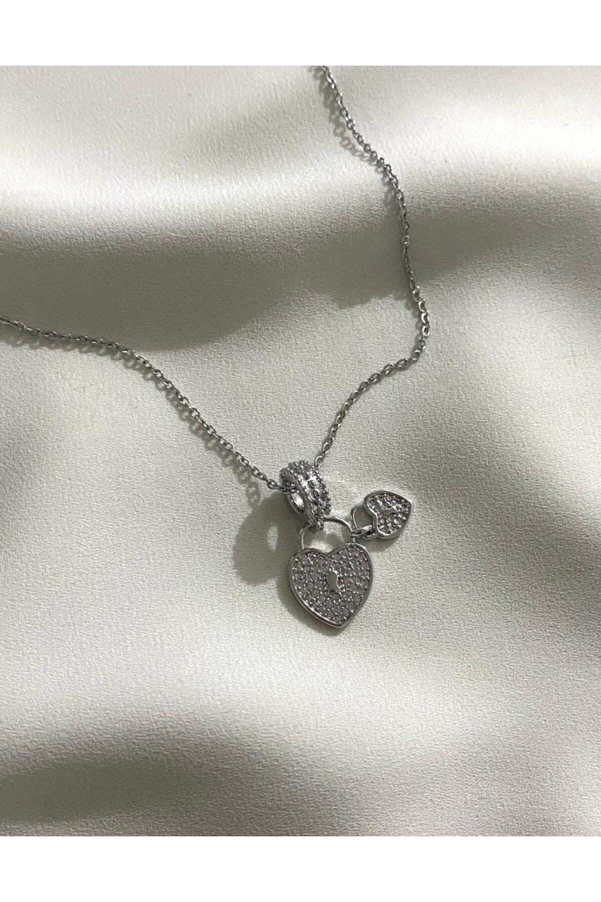 Çelik gümüi charm kolye
