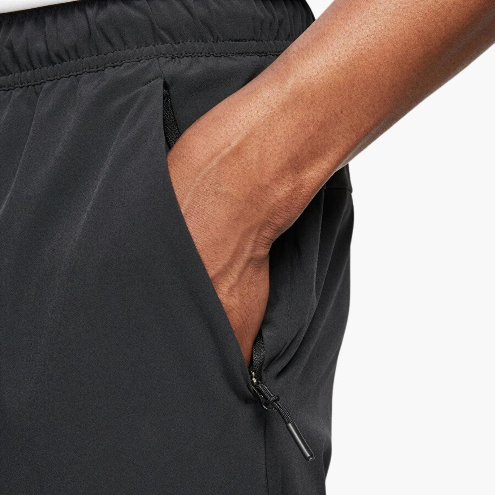 Nike Dri-FIT Unlimited Bileğe Doğru Daralan Eşofman Altı