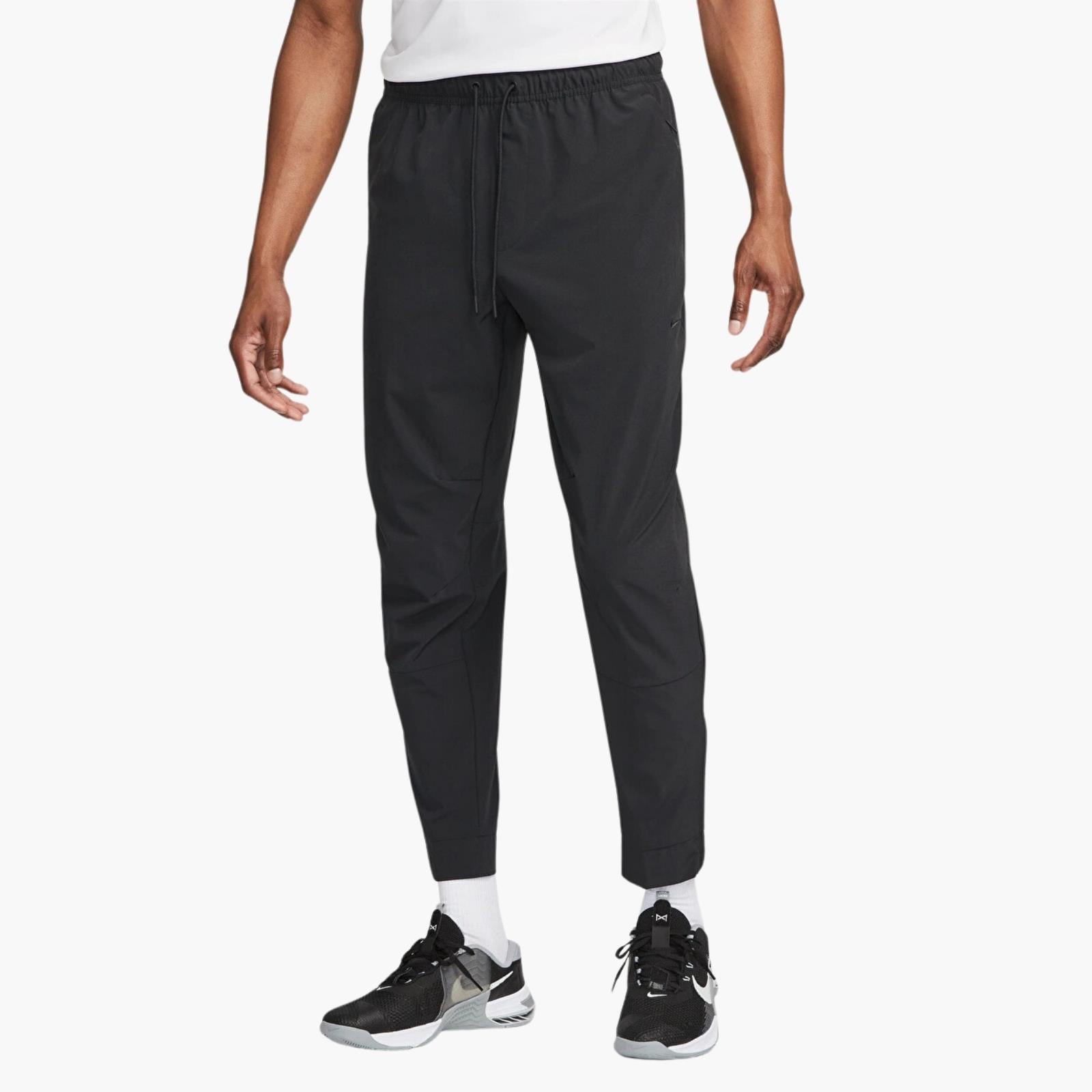 Nike Dri-FIT Unlimited Bileğe Doğru Daralan Eşofman Altı
