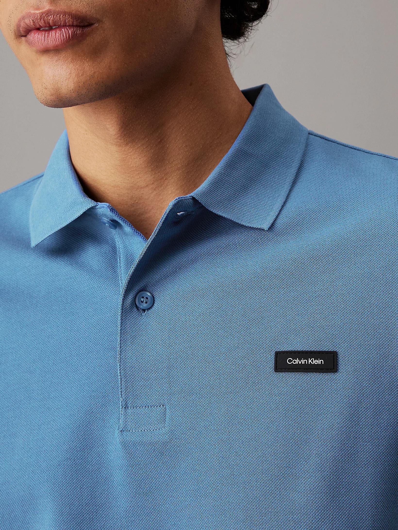 Calvin Klein Calvin Klein Erkek Marka Logolu Polo Yakalı Organik Pamuklu Açık Mavi Polo Yaka T-Shirt K10K111196-CE4