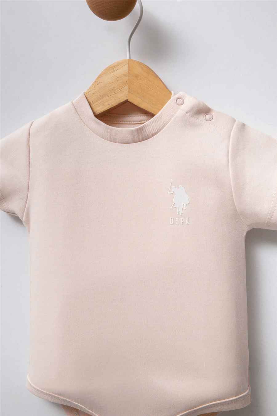 U.S. Polo Assn. Kız Bebek Pamuklu Bisiklet Yaka Pigment Baskılı Yazlık Regular Fit  Badi Zıbın 3-24 Ay Pudra