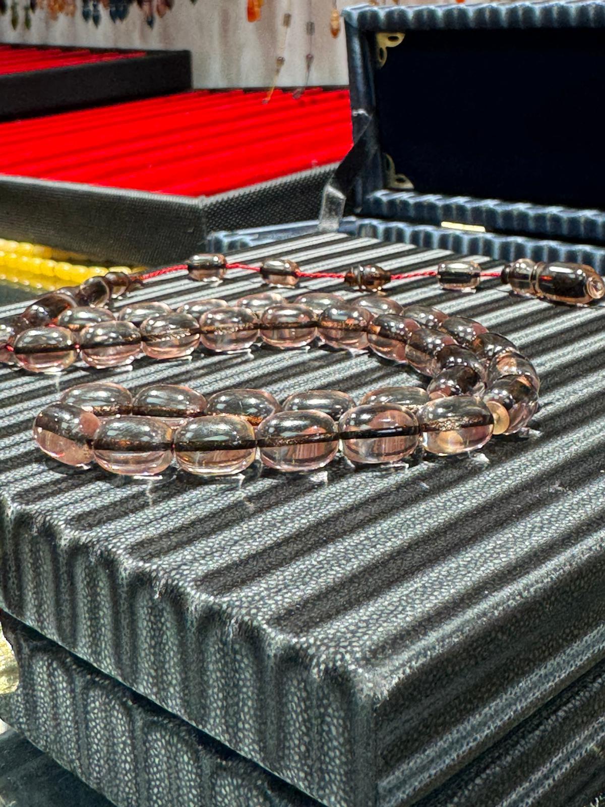 İp Yolları Sürmeli Ateş Kehribar Tesbih 8x11 mm Kapsül Kesim