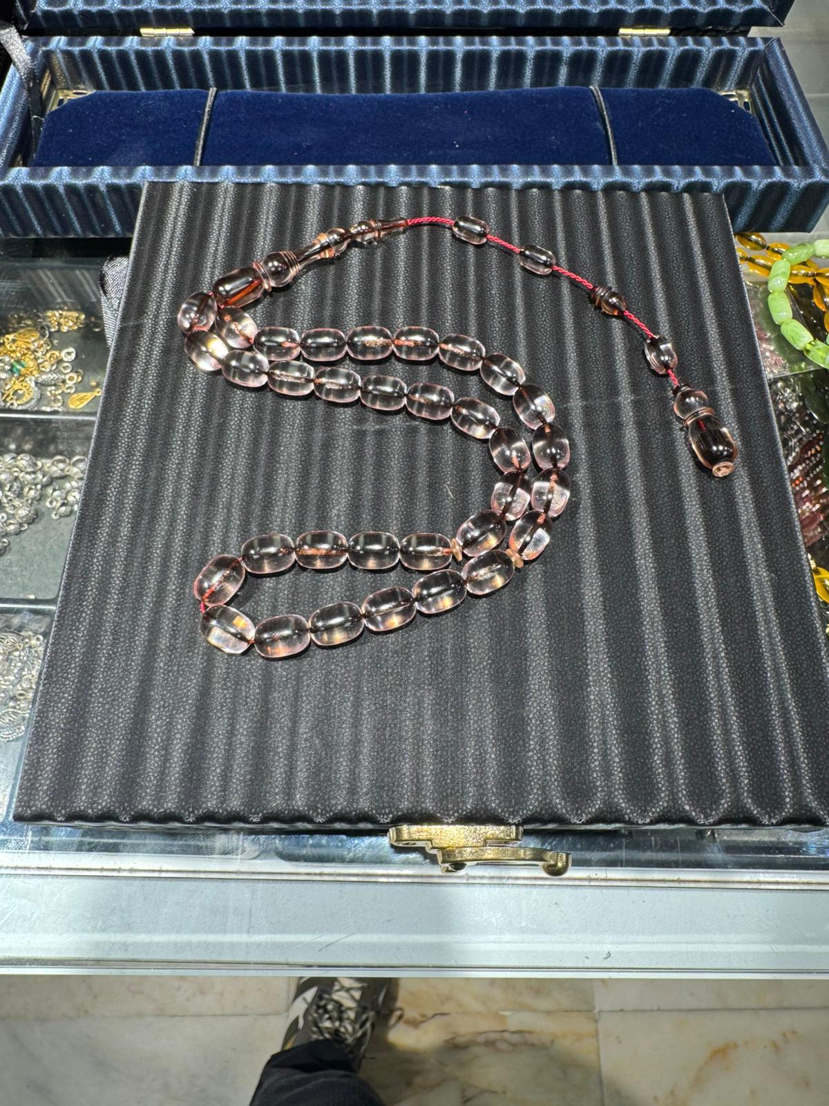 İp Yolları Sürmeli Ateş Kehribar Tesbih 8x11 mm Kapsül Kesim