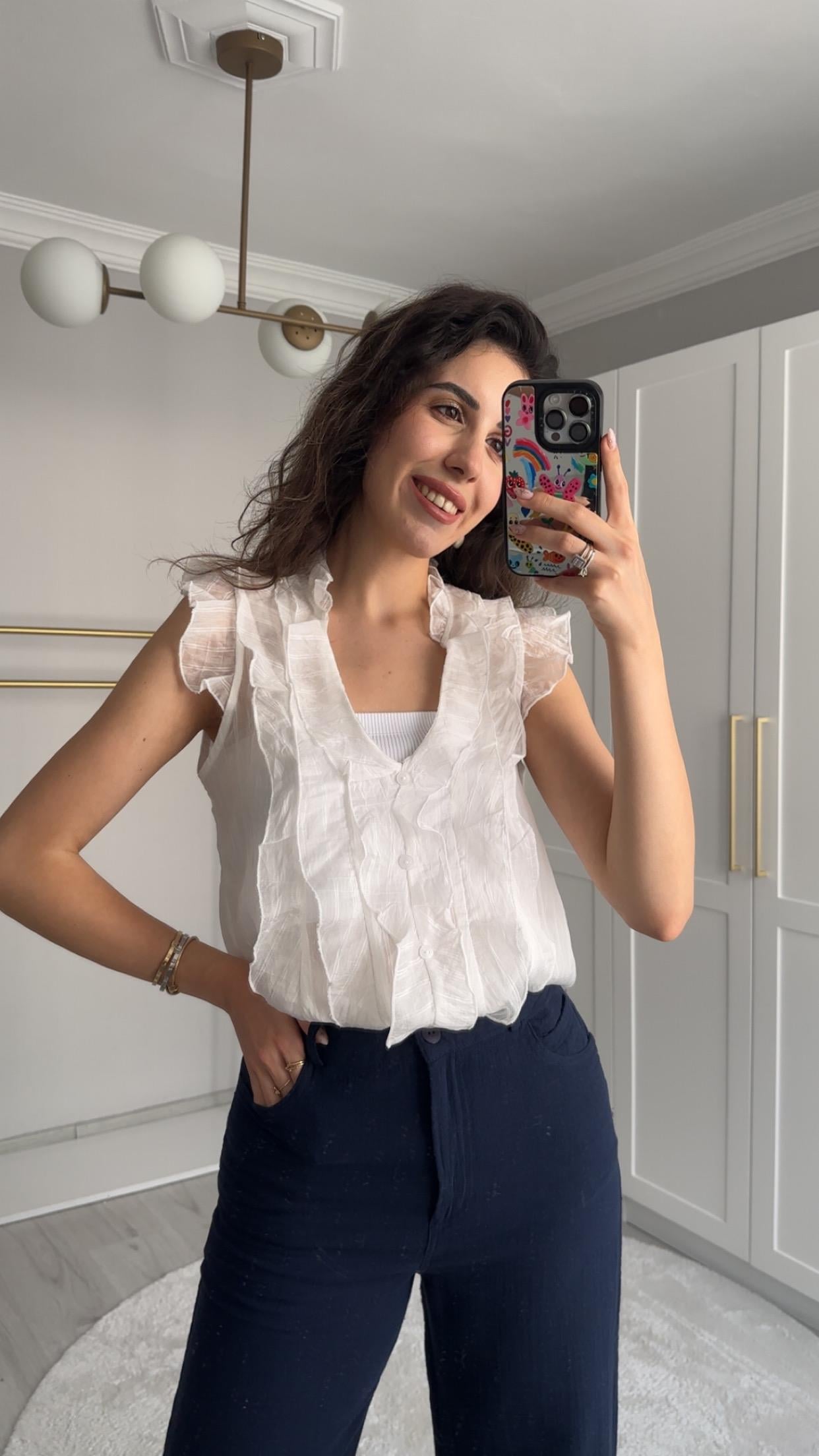 FIRFIRLI TRANSPARAN KOLSUZ BEYAZ BLUZ