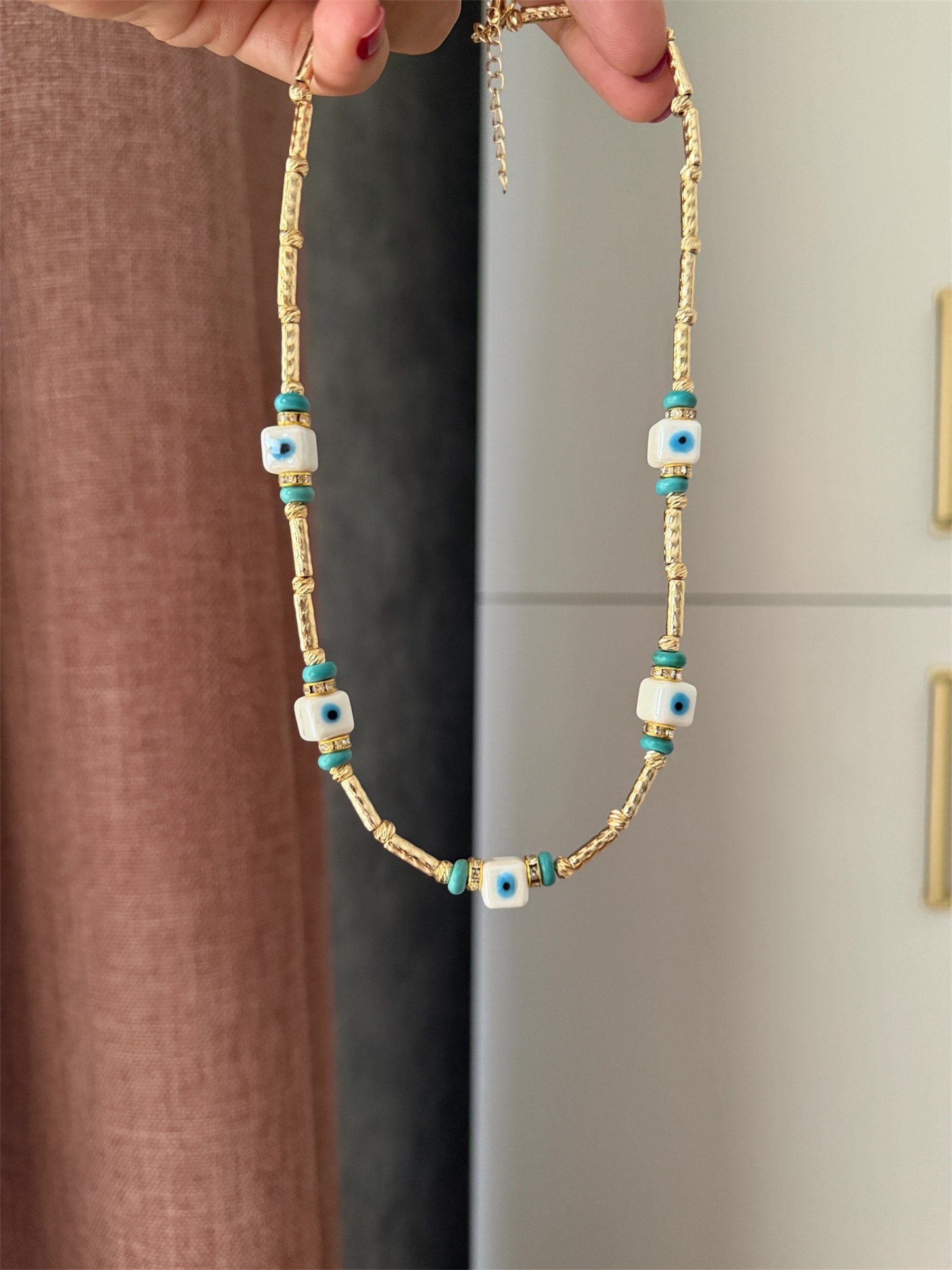 14K gold renk nazar temalı tam bir yaz sezonu ışıltısı çok şık kolye