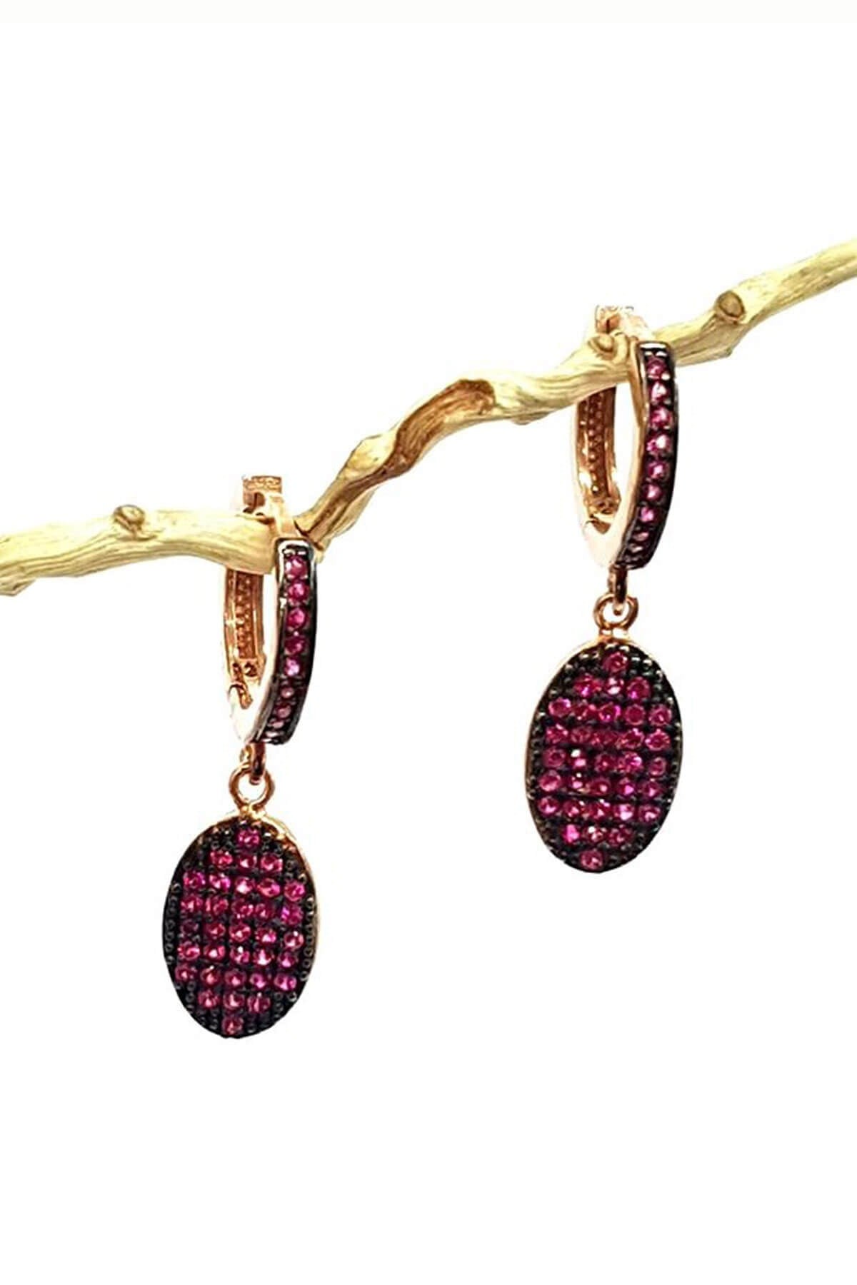 Pembe zirkon taşlı sallantılı gümüş küpe