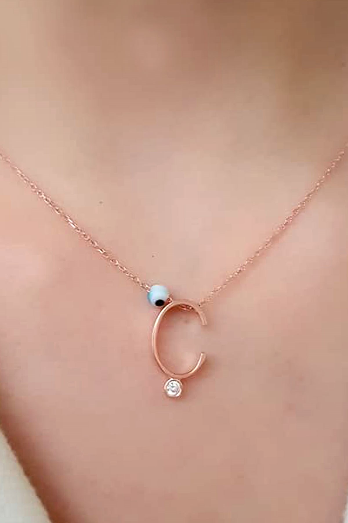 Nazar boncuklu ve zirkon taş detaylı gümüş rose Ç harfi  kolye