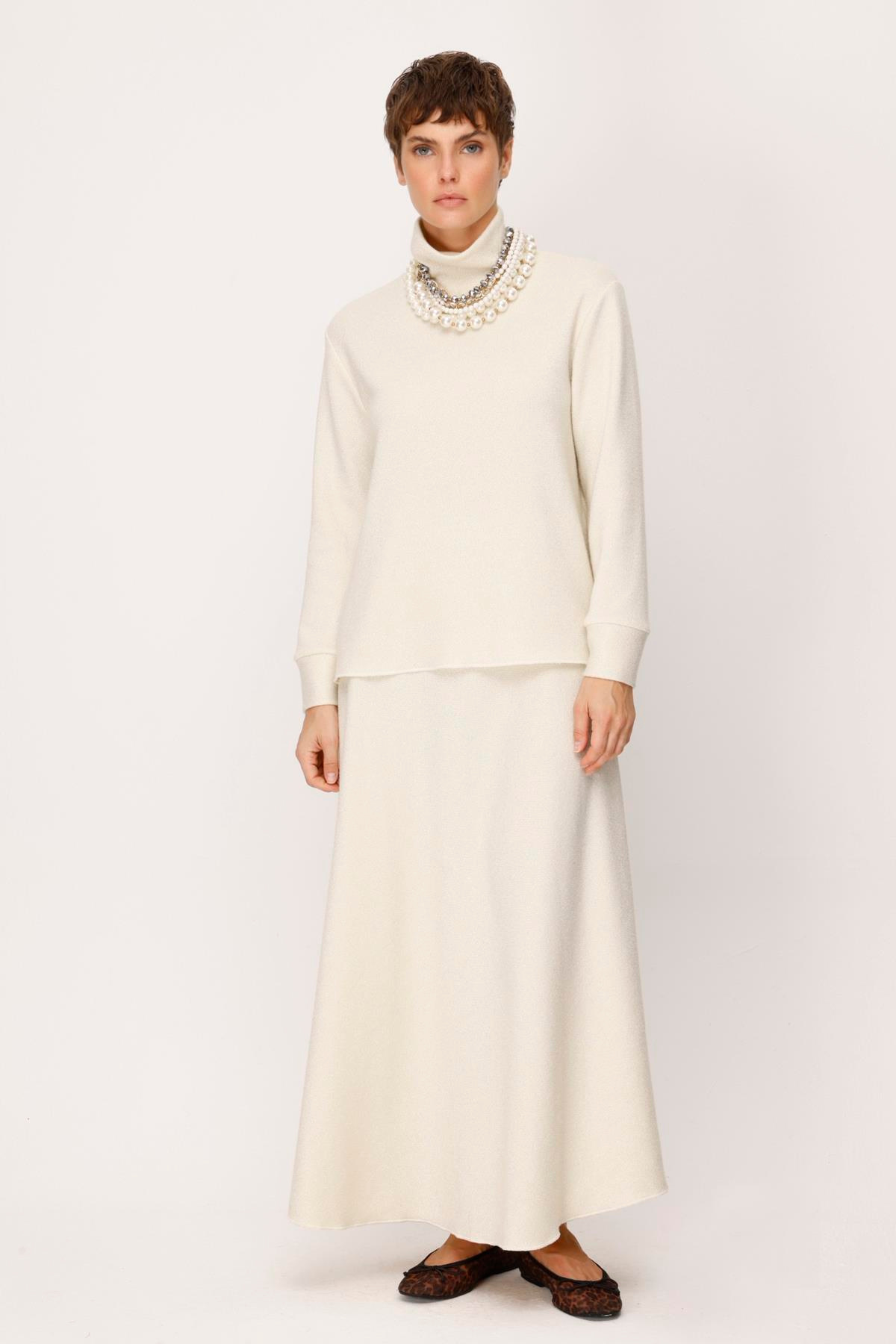 ÖRME KENDİNDEN LUREXLİ EVAZE UZUN ETEK