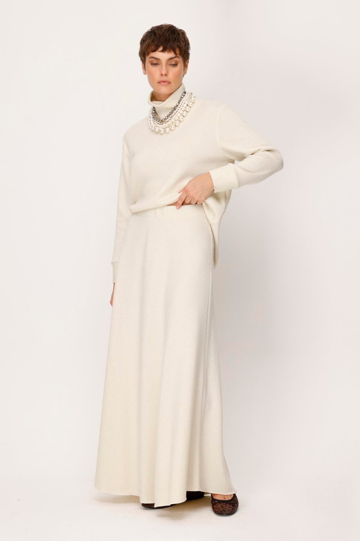 ÖRME KENDİNDEN LUREXLİ EVAZE UZUN ETEK