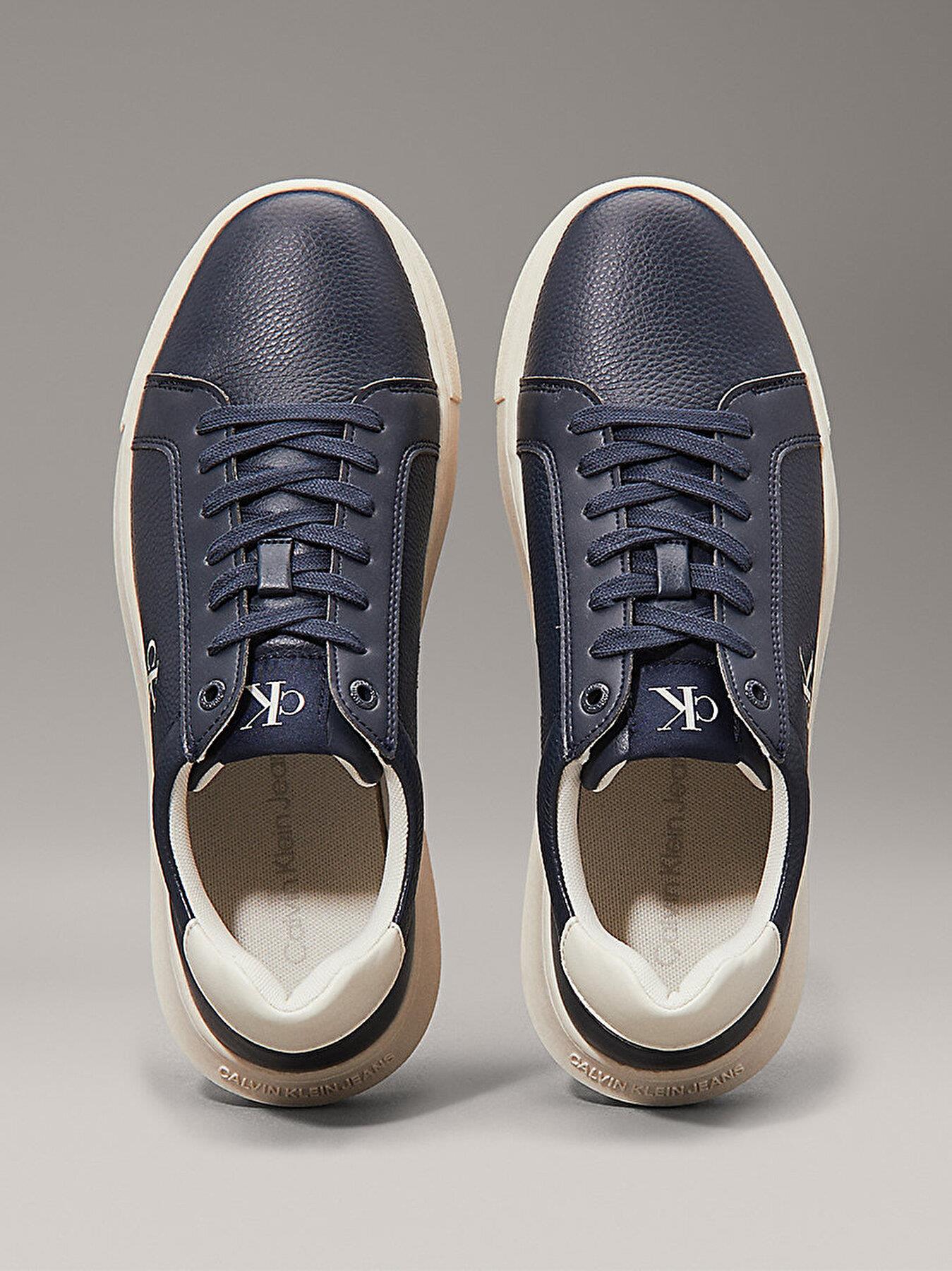 Calvin Klein Calvin Klein Erkek Düşük Bilekli Deri Rahat ve Düz Tabanlı Logo Kabartmalı Lacivert Sneaker YM0YM01198-0G1