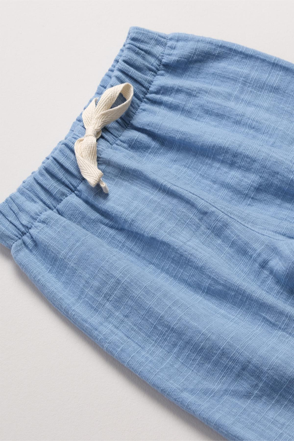 Bonderro Flamlı Müslin Bol Kesim Unisex Çocuk Pantolonu %100 PamukBonderro Flamlı Müslin Bol Kesim Unisex Çocuk Pantolonu %100 Pamuk